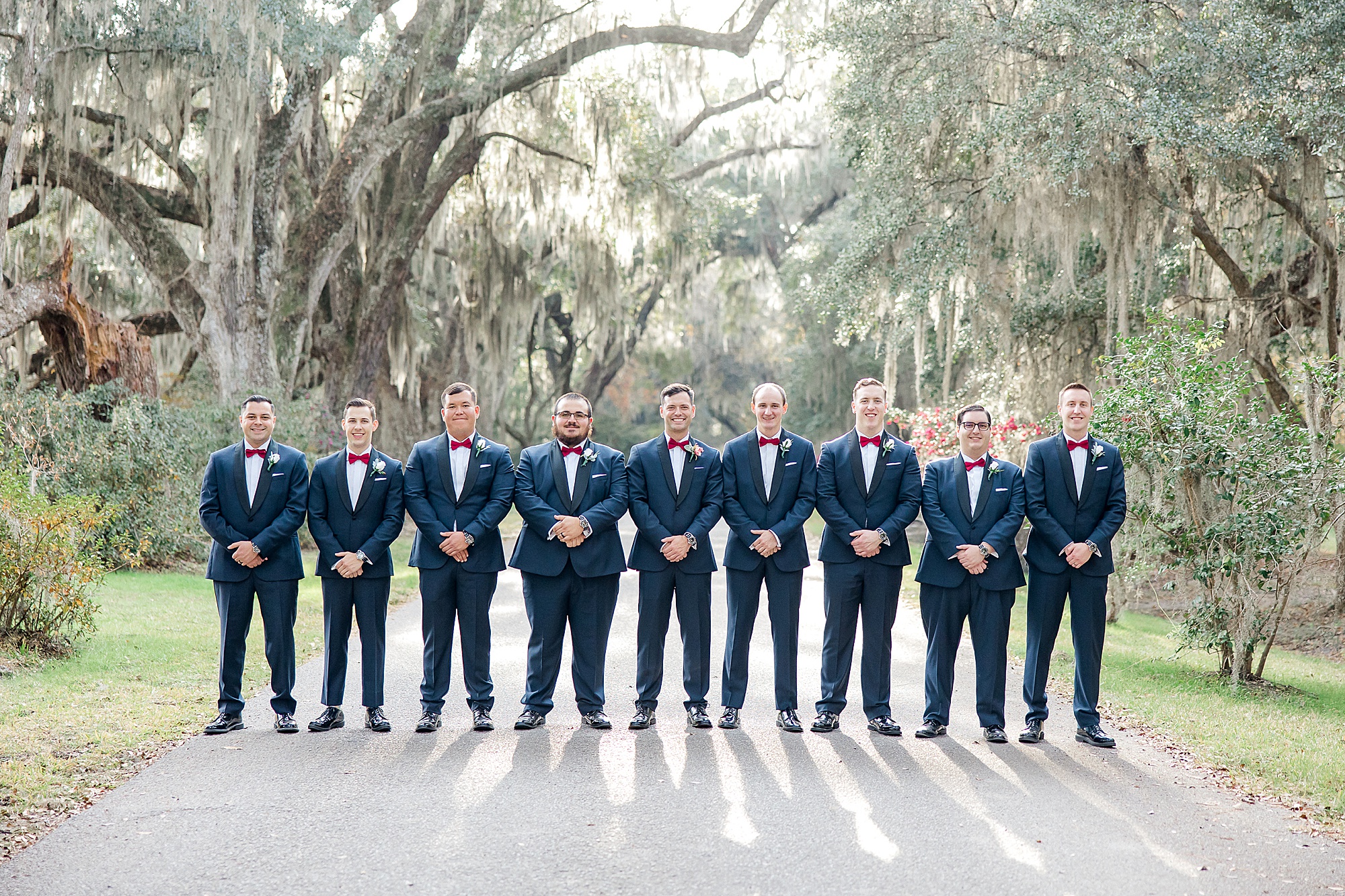 Groom and Groomsmen stand together before wedding ceremony in Charleston SC