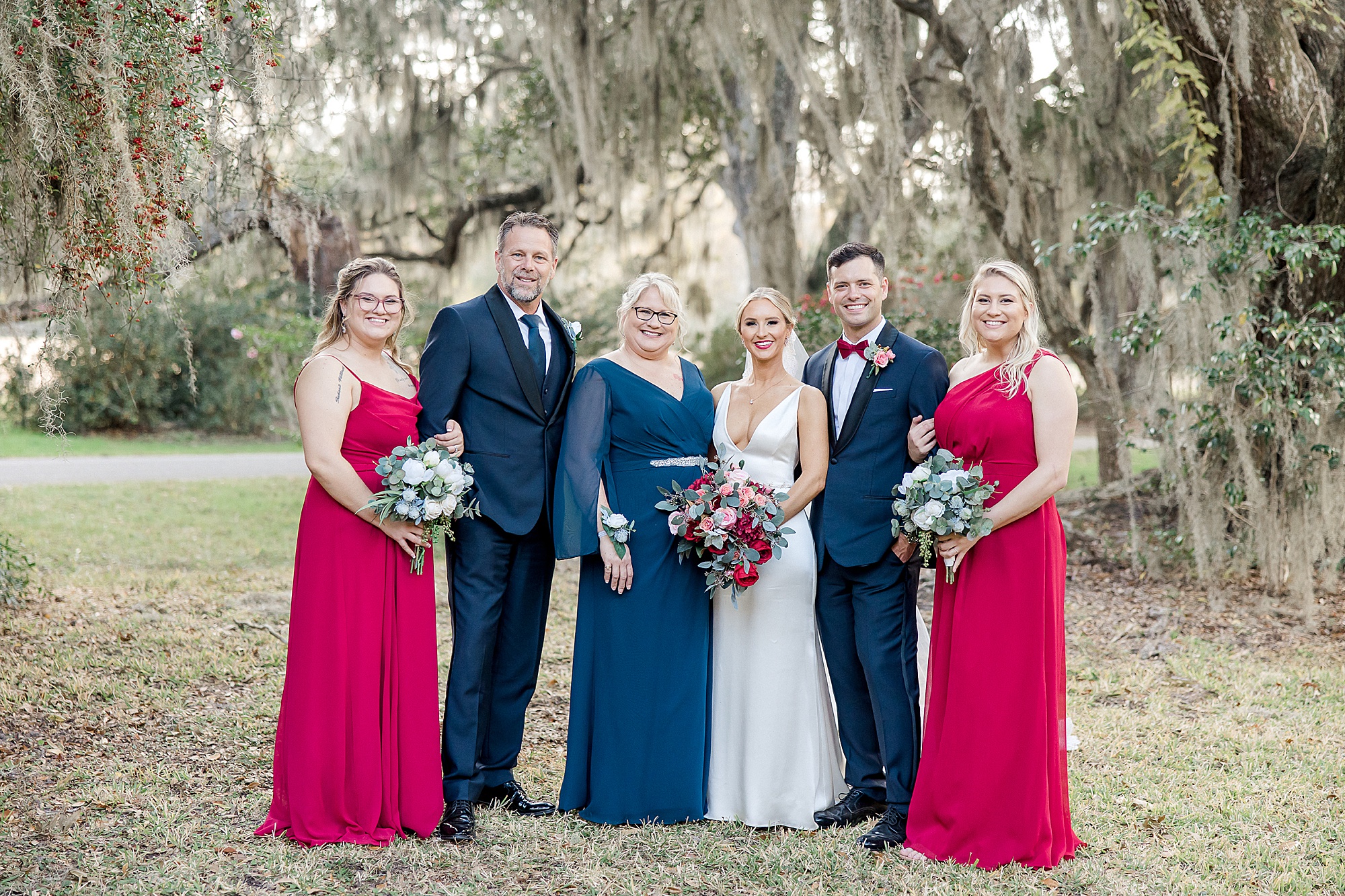 bride and groom with family