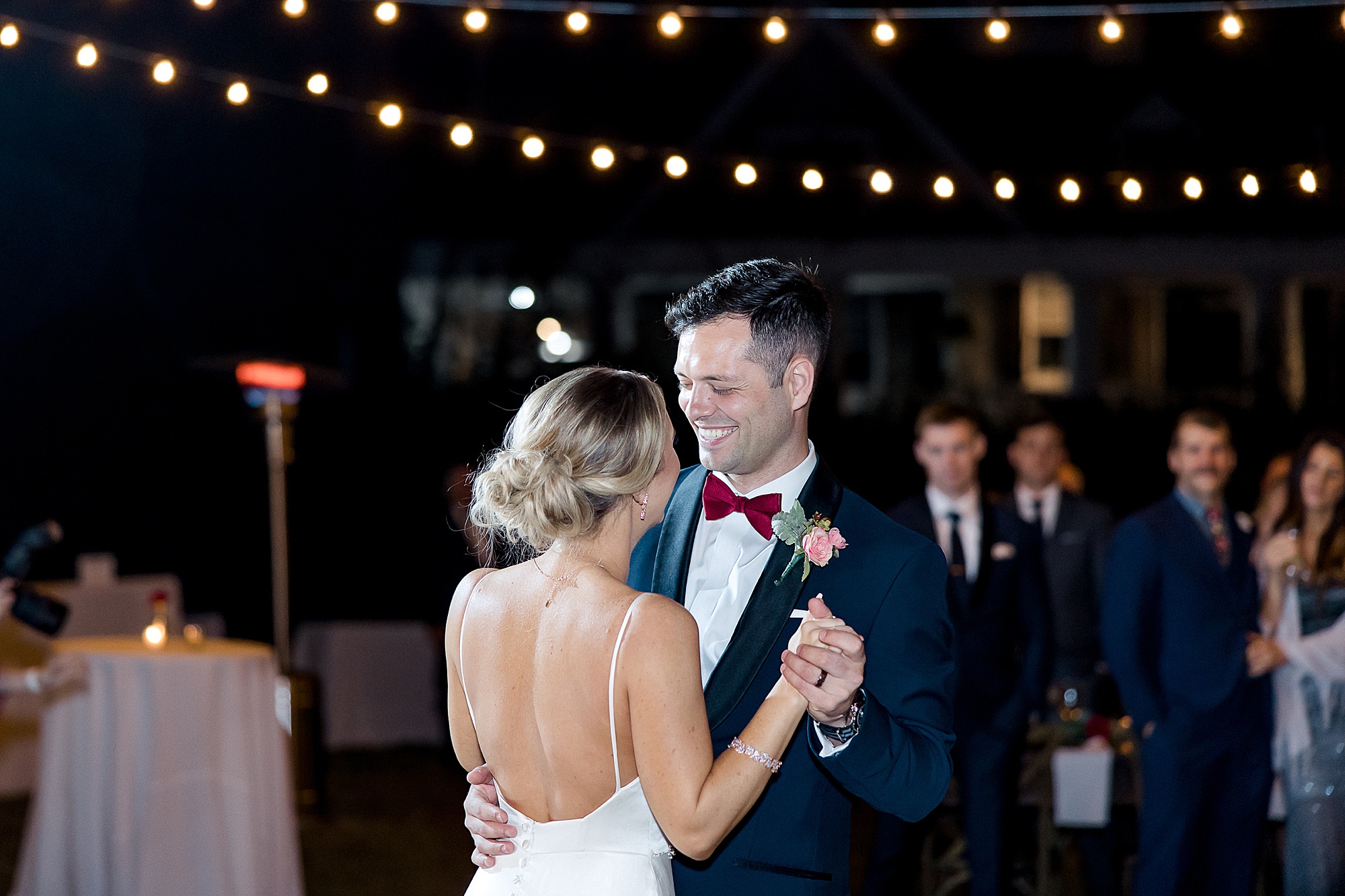 bride and groom share first dance at wedding reception