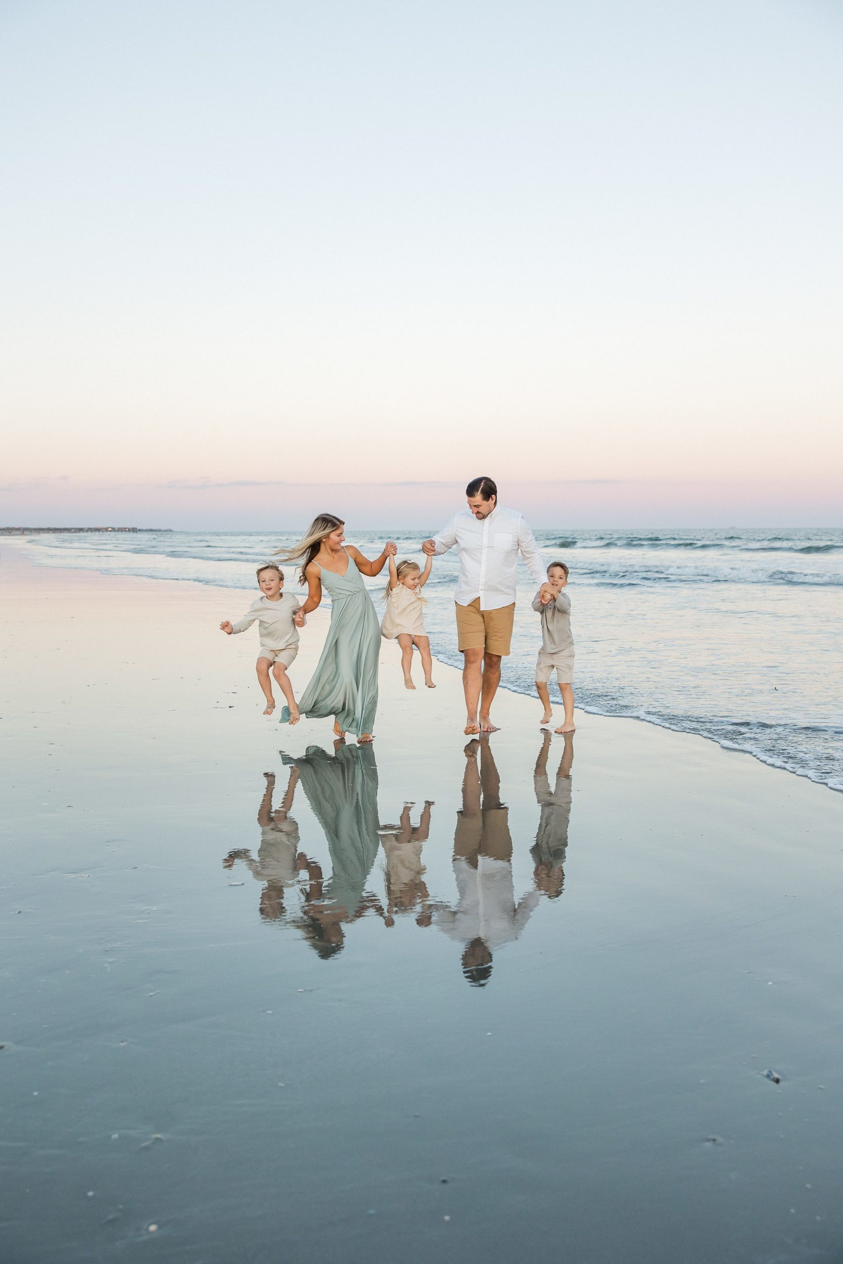 family walks on beach