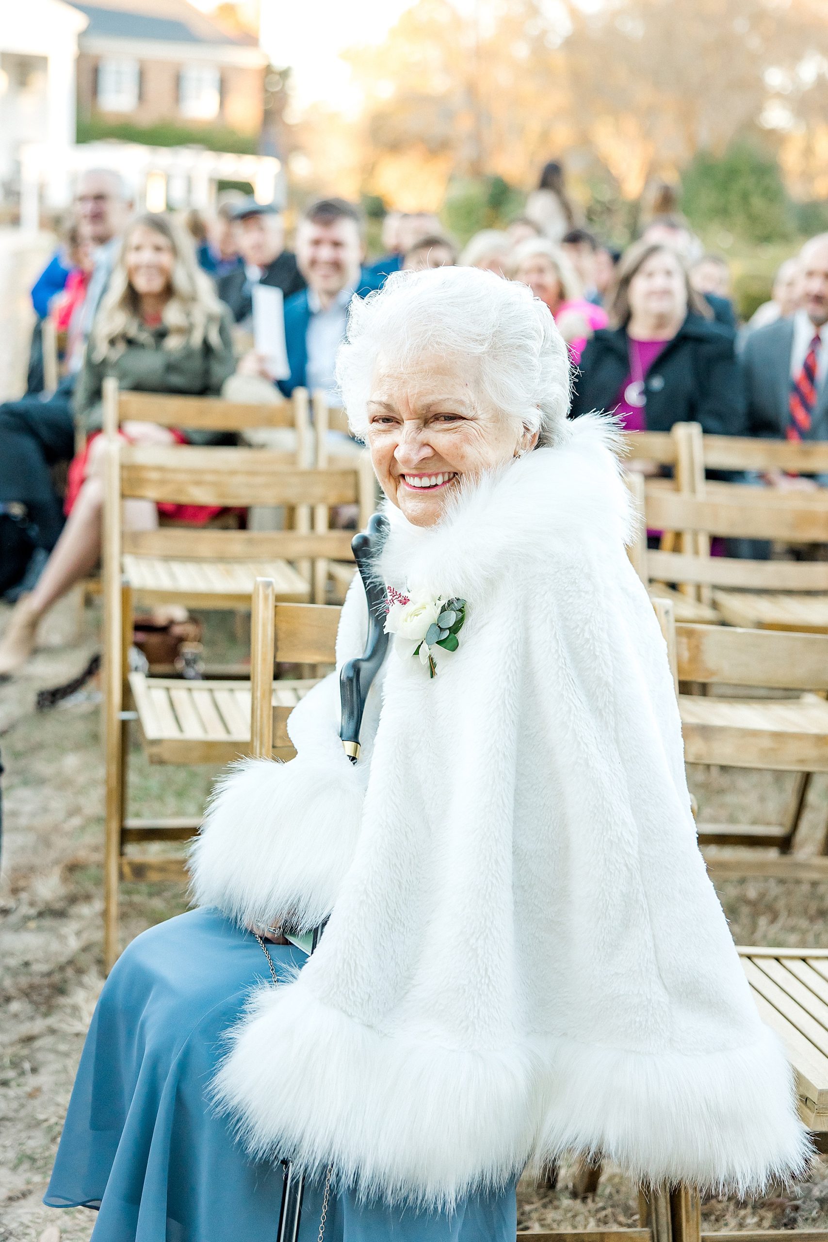 excited Grandmother waits for wedding ceremony to start