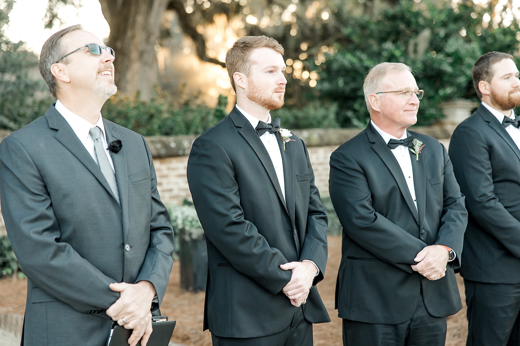 groom waits for his bride during wedding ceremony at Boone Hall