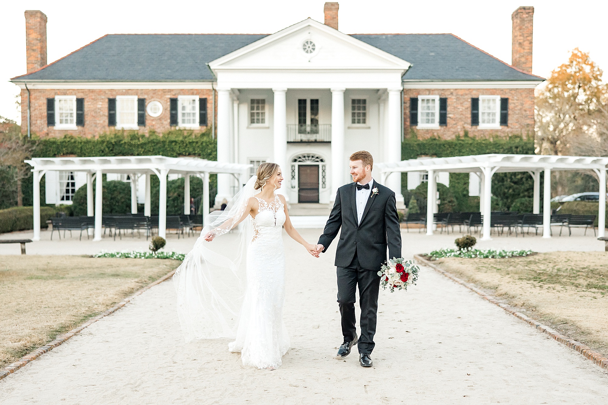 Couple outside of mansion at Boone Hall in Charleston SC
