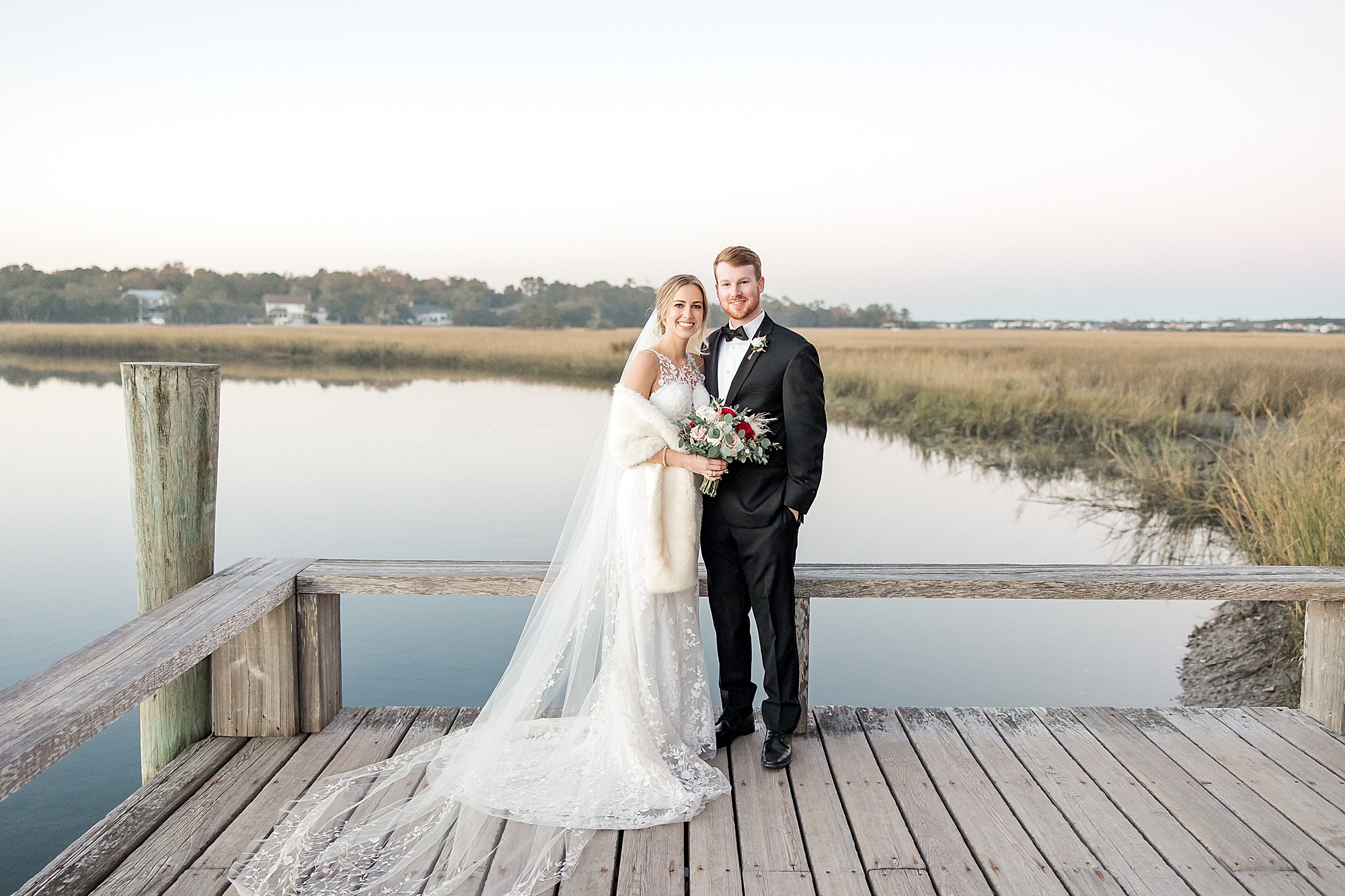 couple standing on the Cotton Deck during wedding reception at Boone Hall Plantation