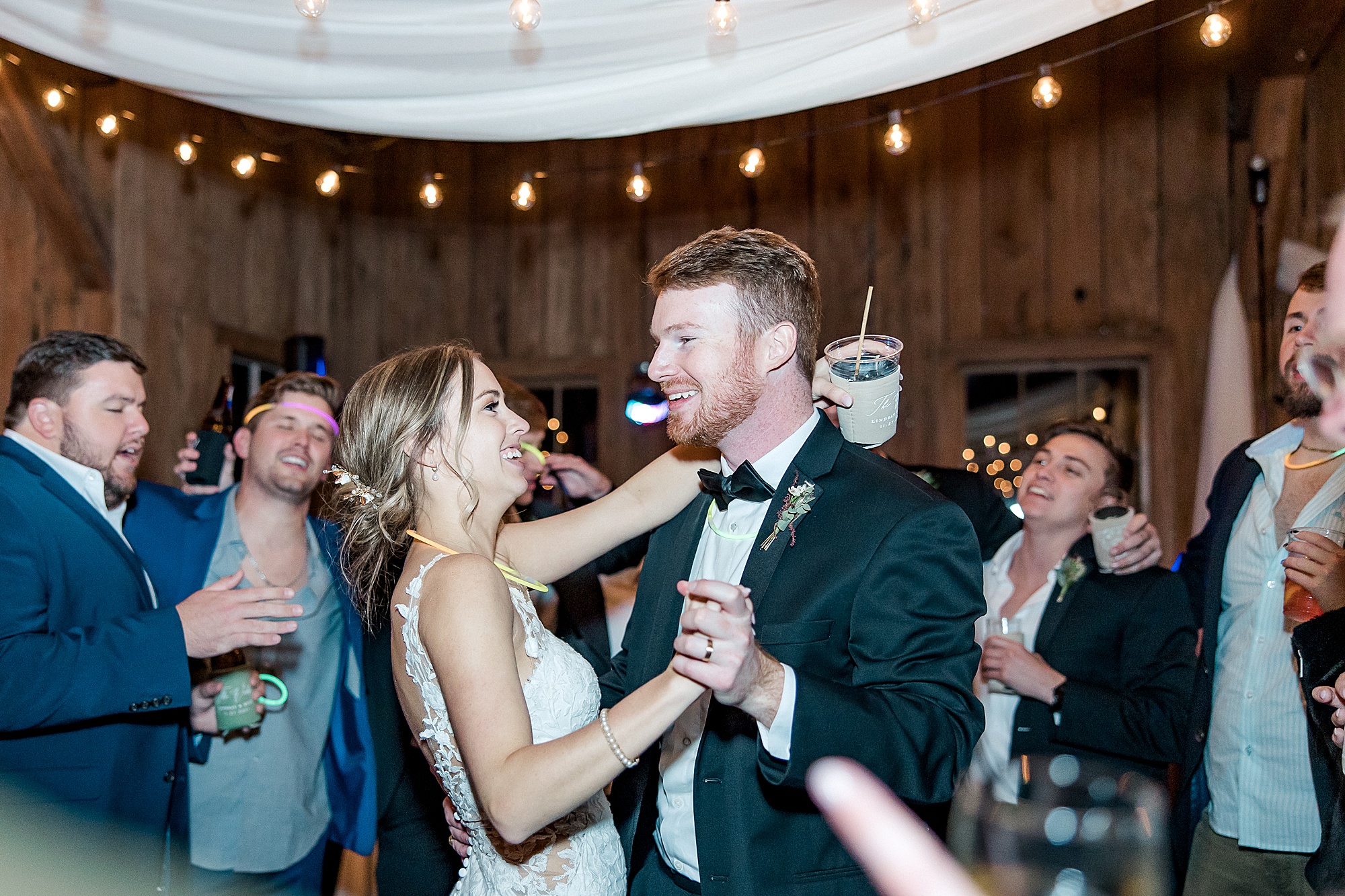 bride and groom dance with wedding guests at Boone Hall Plantation