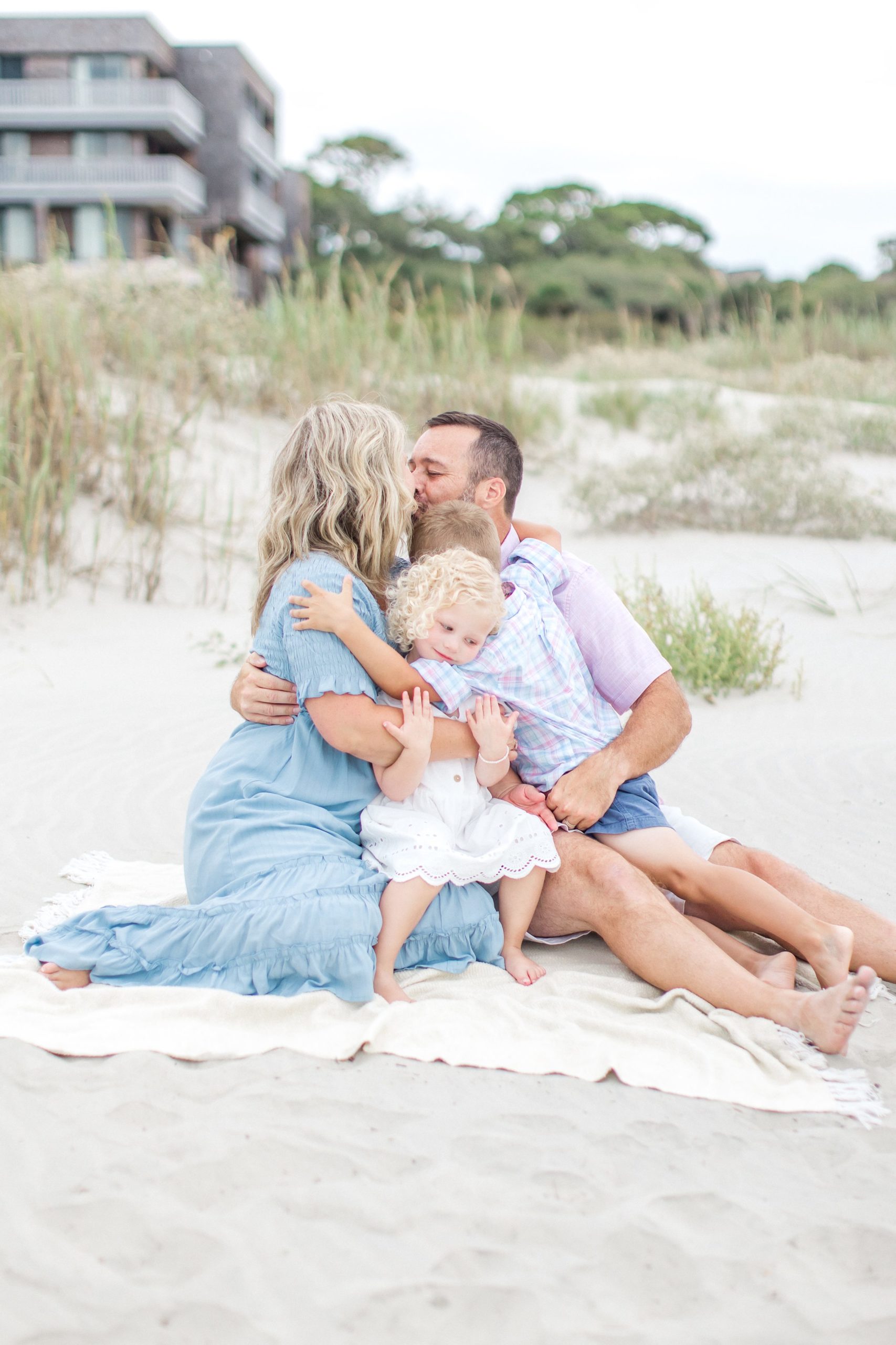 Family hugs on Charleston beach