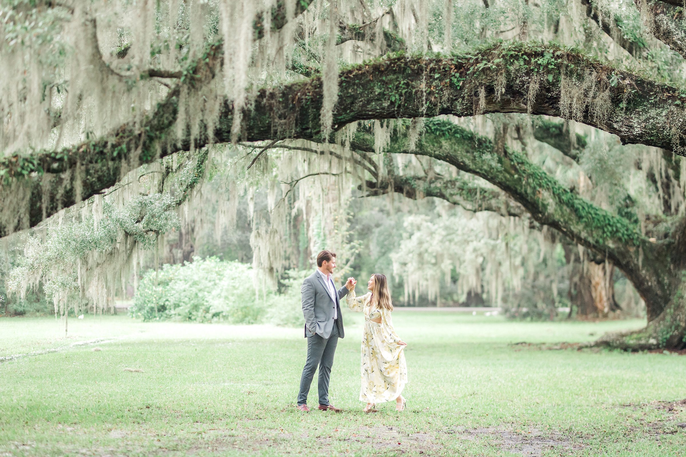 Couple dances under oak trees at Magnolia Plantation and Gardens