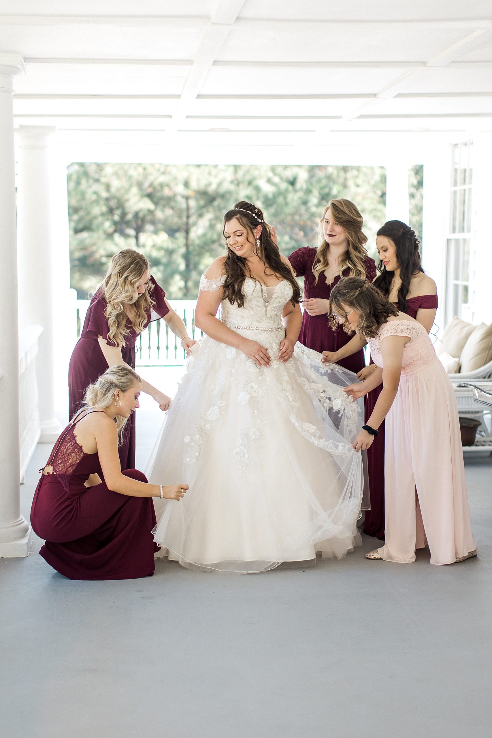 bride and her bridesmaids before wedding ceremony