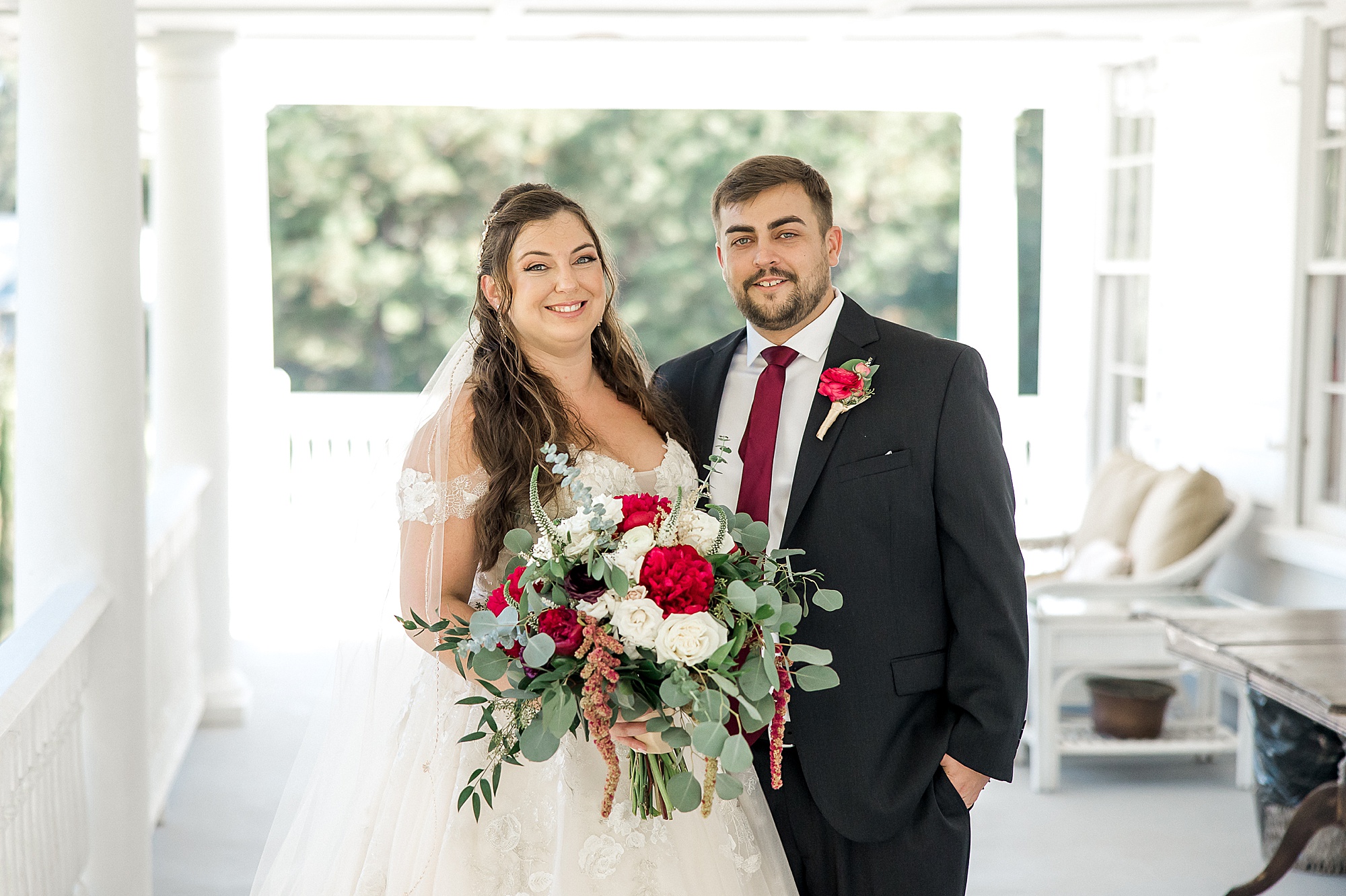 bride and groom portraits on the porch of Old Wide Awake Plantation