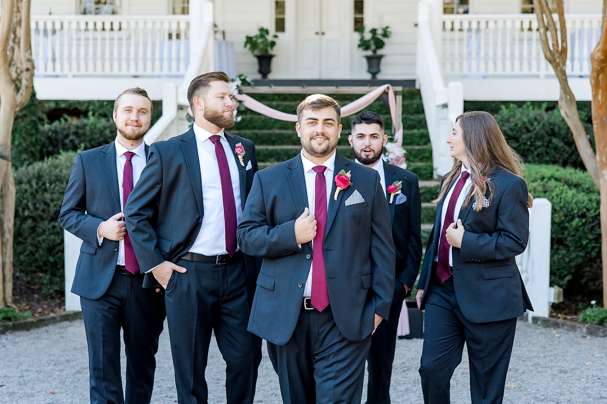 groomsmen stand around groom