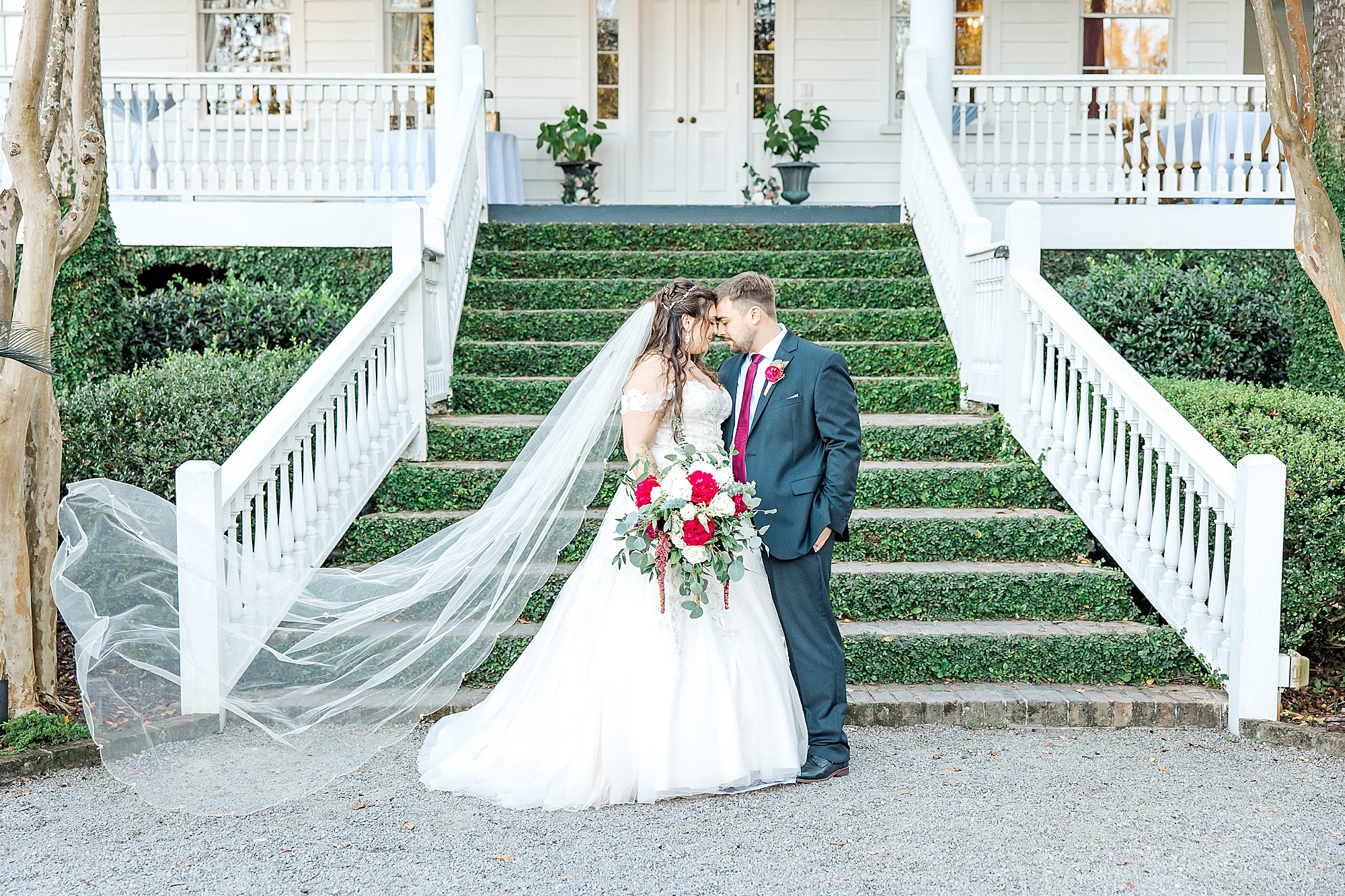bride and groom in front of the Old Wide Awake Plantation
