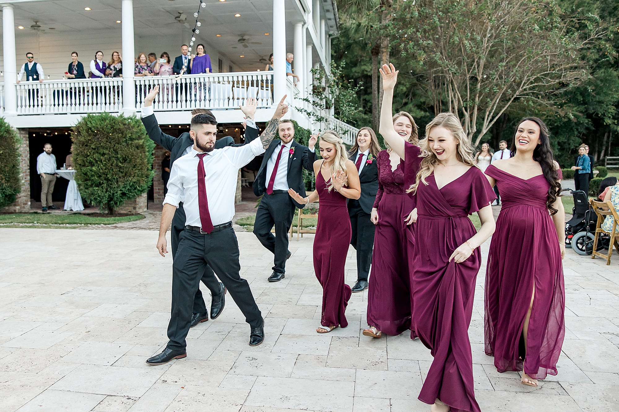 bridal party entering dance floor at outdoor reception