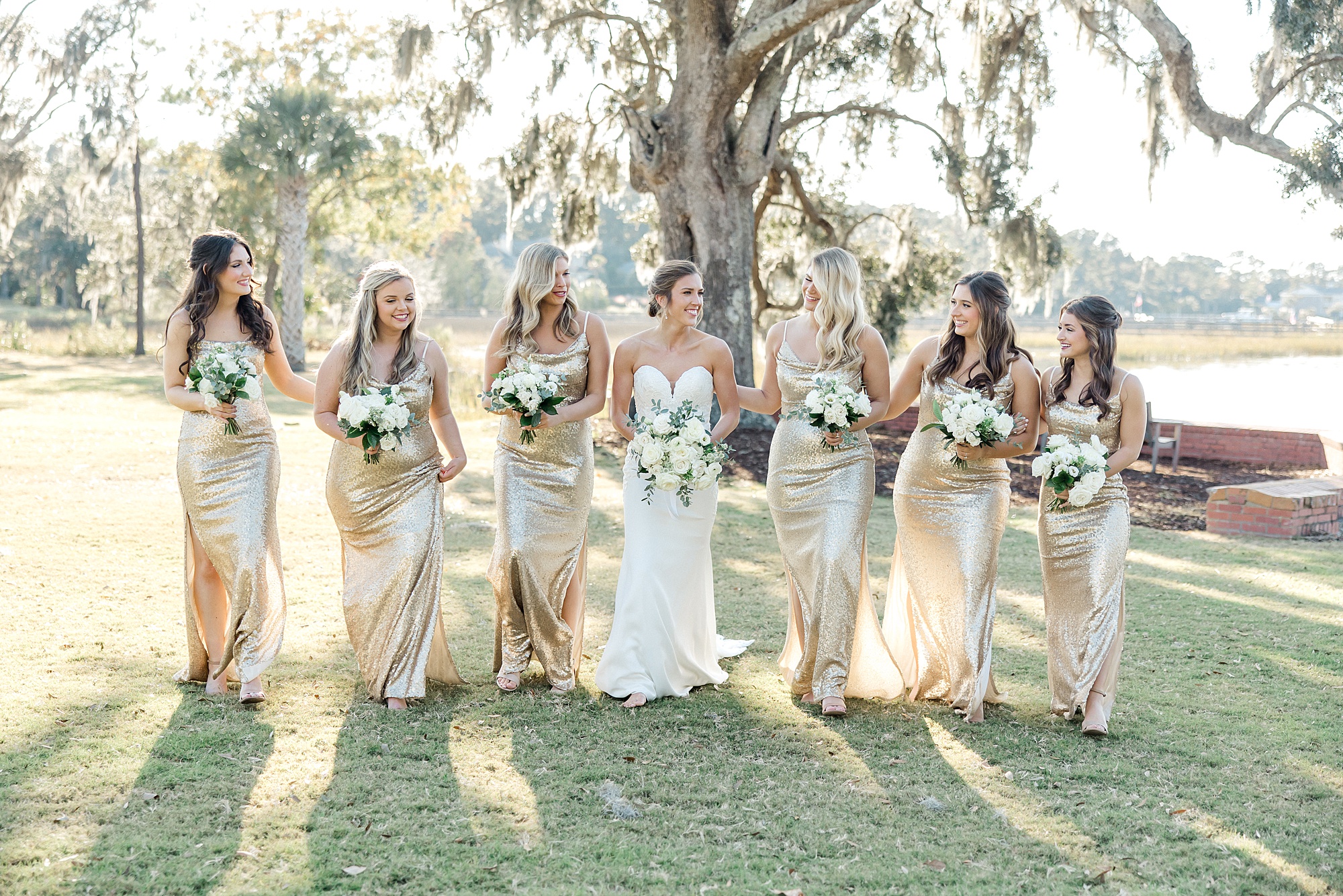 classic white flower bouquets and champagne bridesmaids dresses