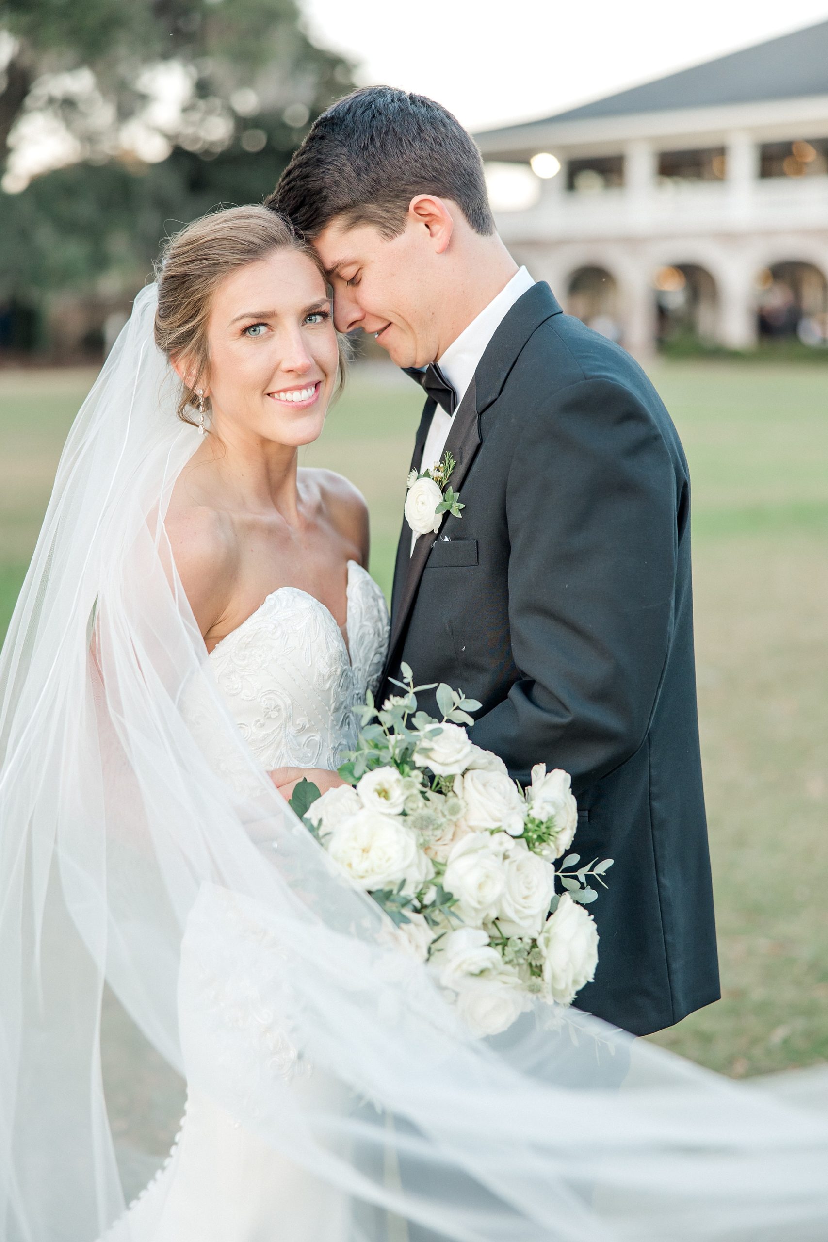 newlywed portraits with classic white flower bouquet