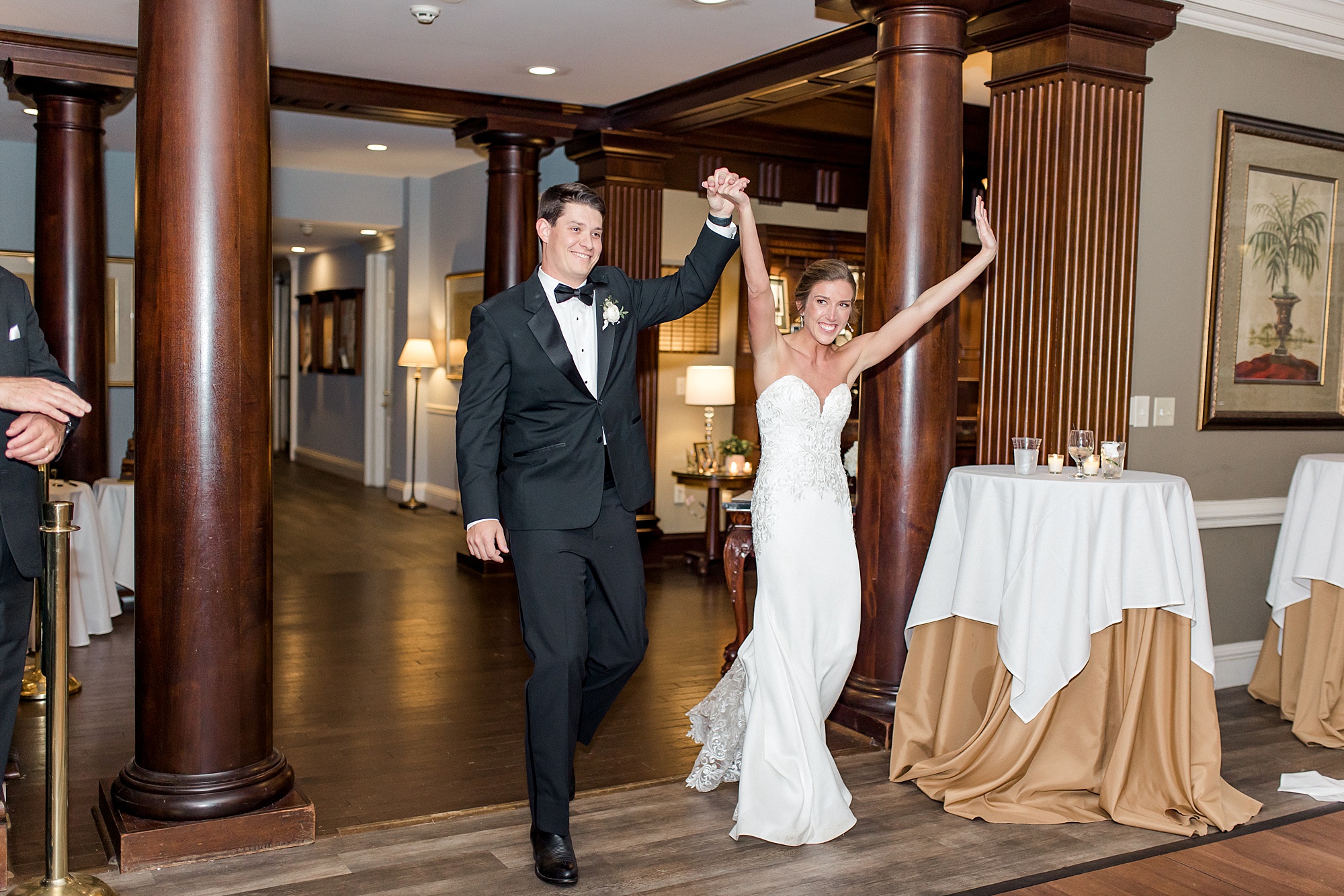 newlyweds enter wedding reception
