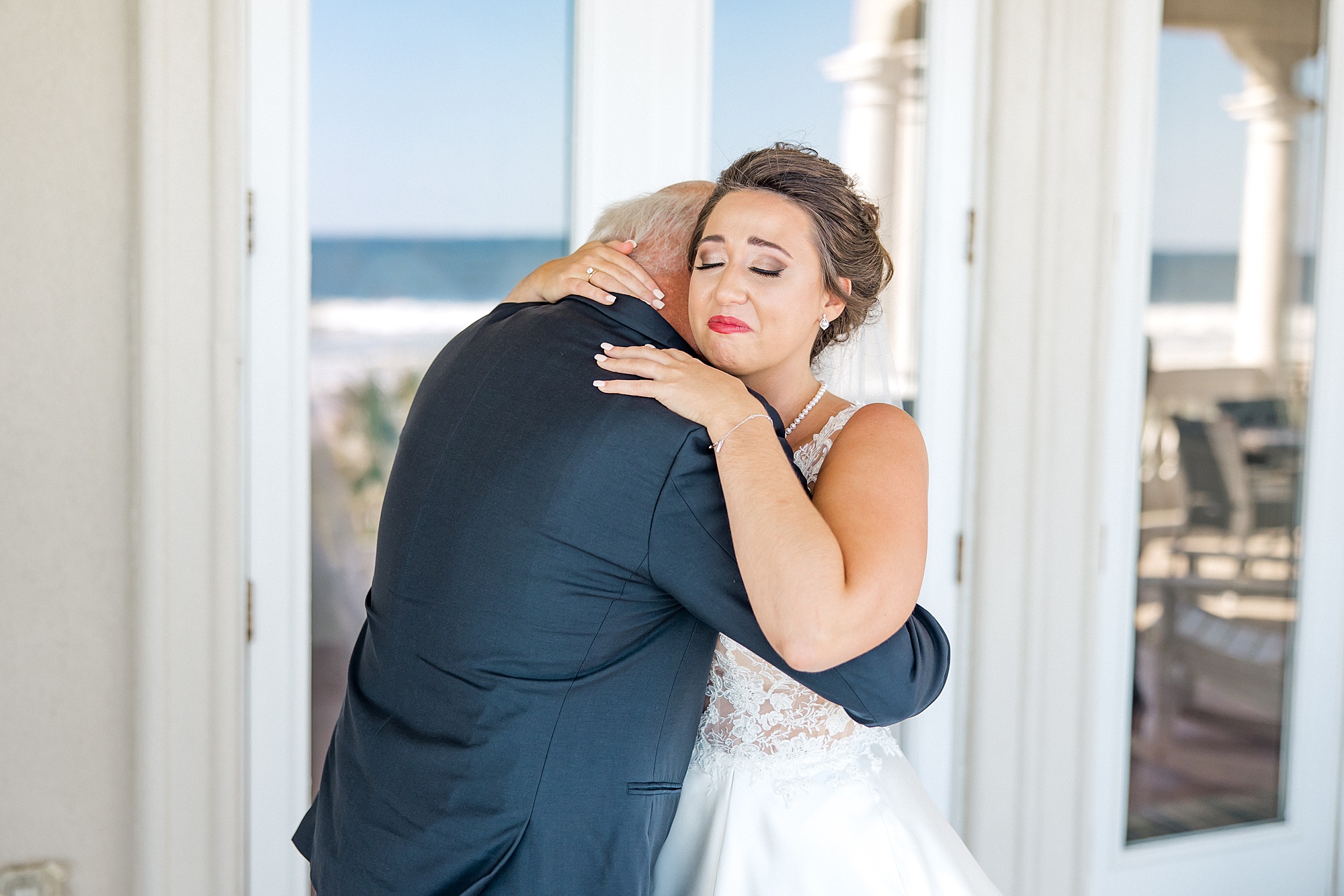 emotional moment between father and daughter at Ocean Isle Beach Wedding