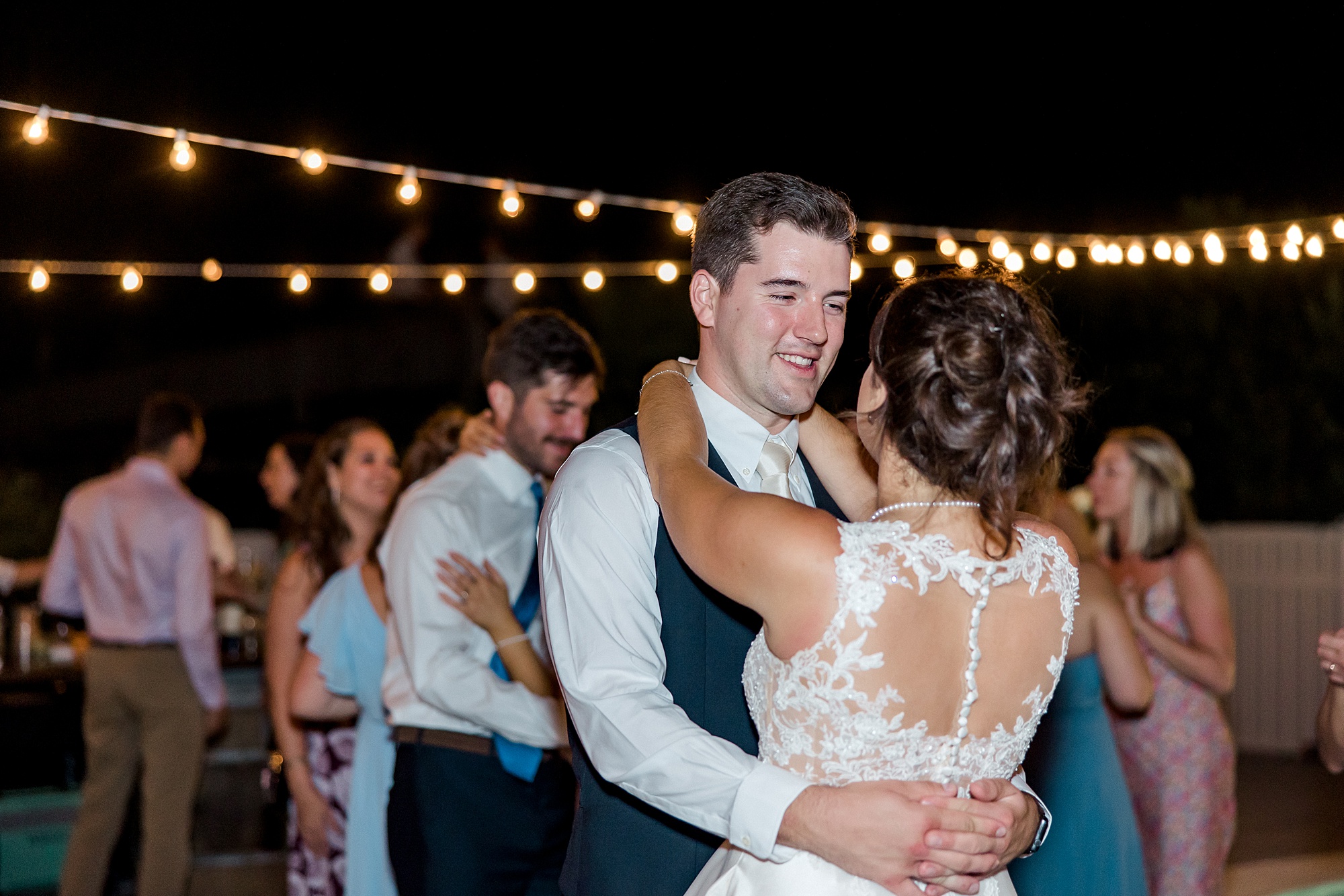 newlyweds slow dance into the evening