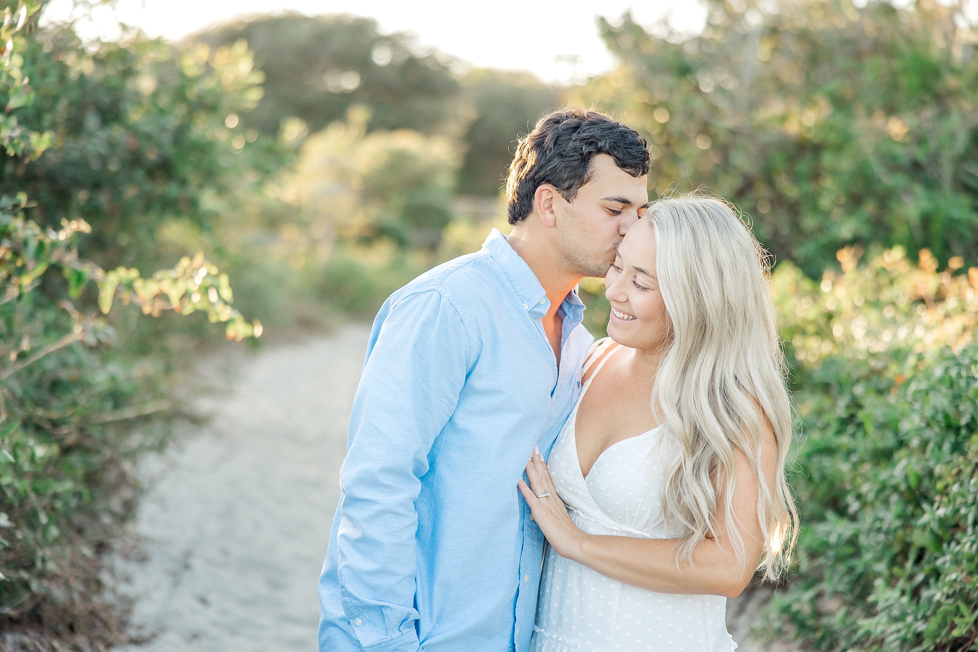 man kisses his fiance during engagement session