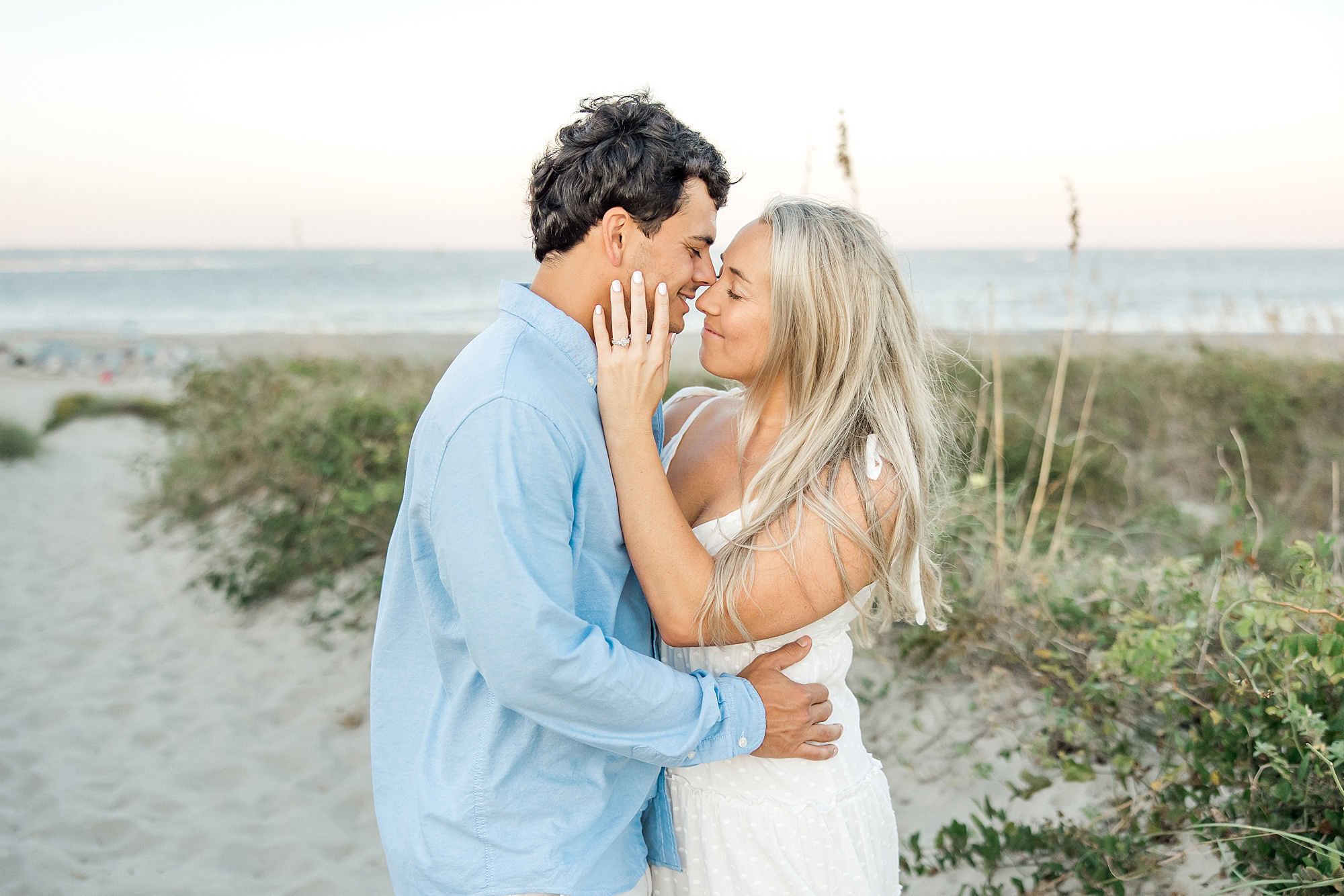couple kiss during Folly Beach Engagement Session