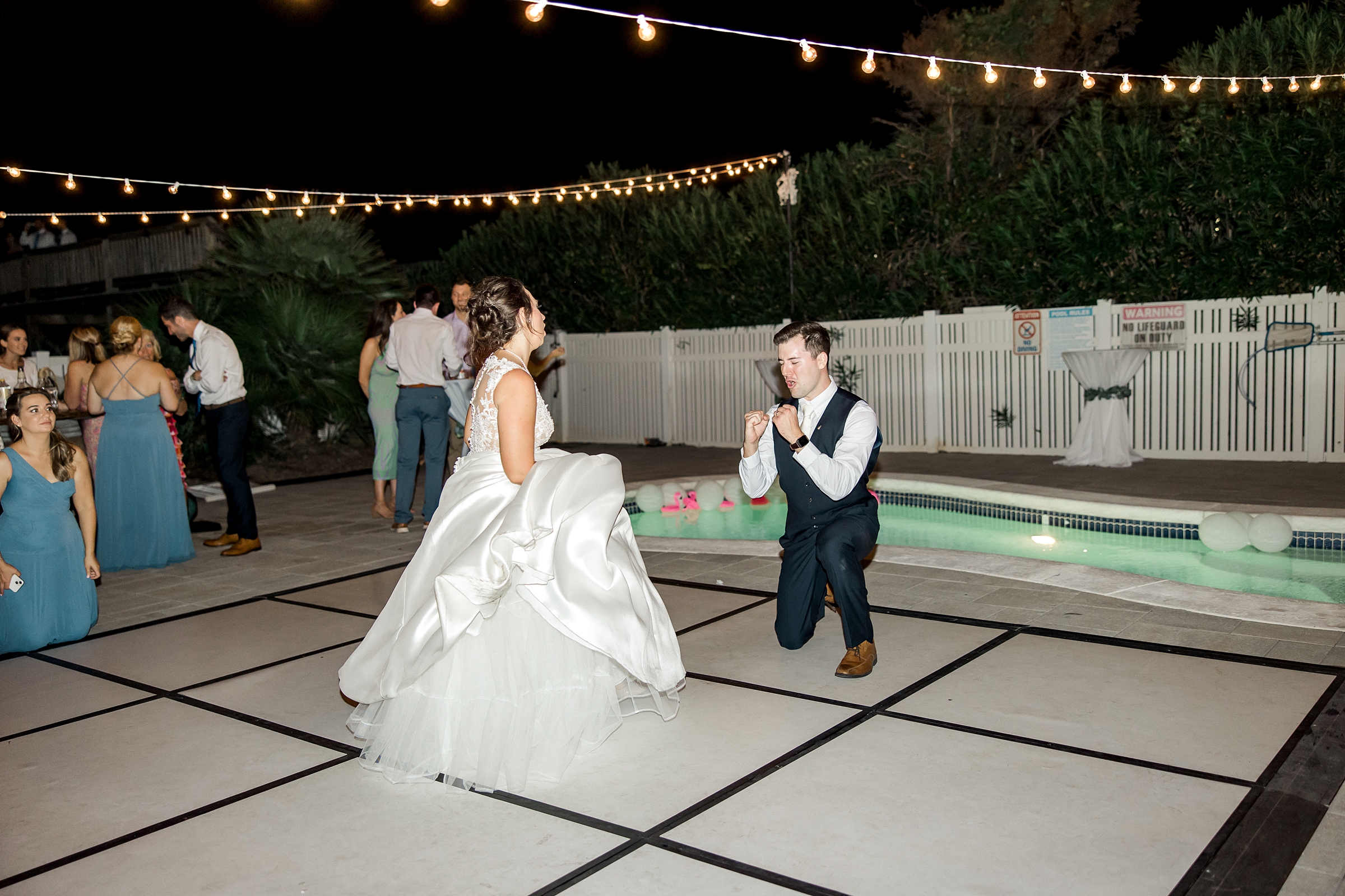 bride and groom have fun on the dance floor