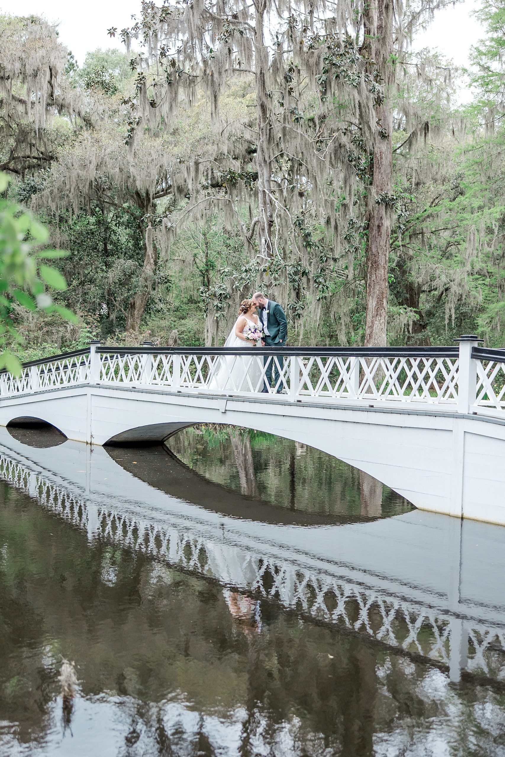 couple on iconic white bridge in Charleston