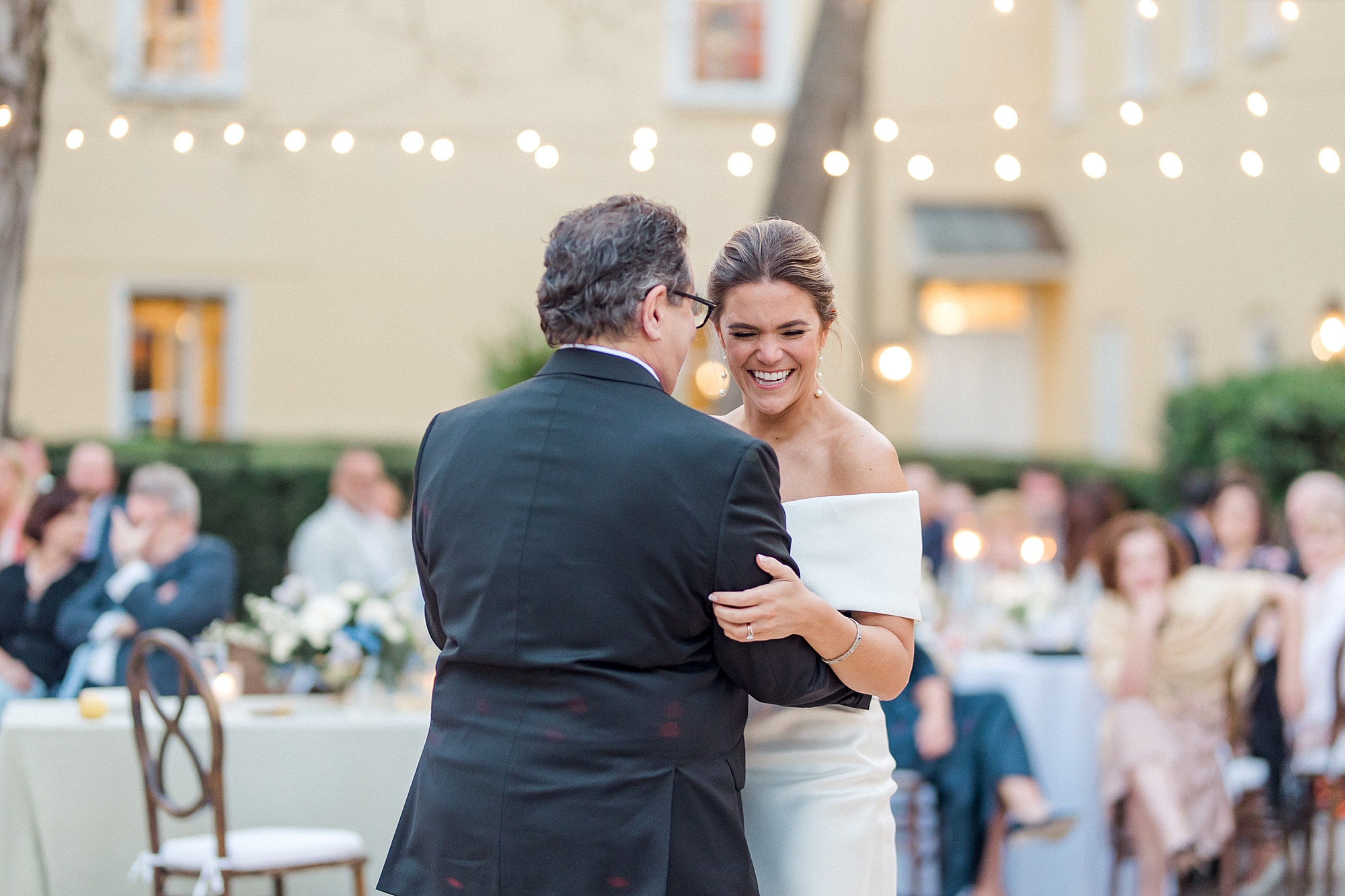 bride and her father share a dance together