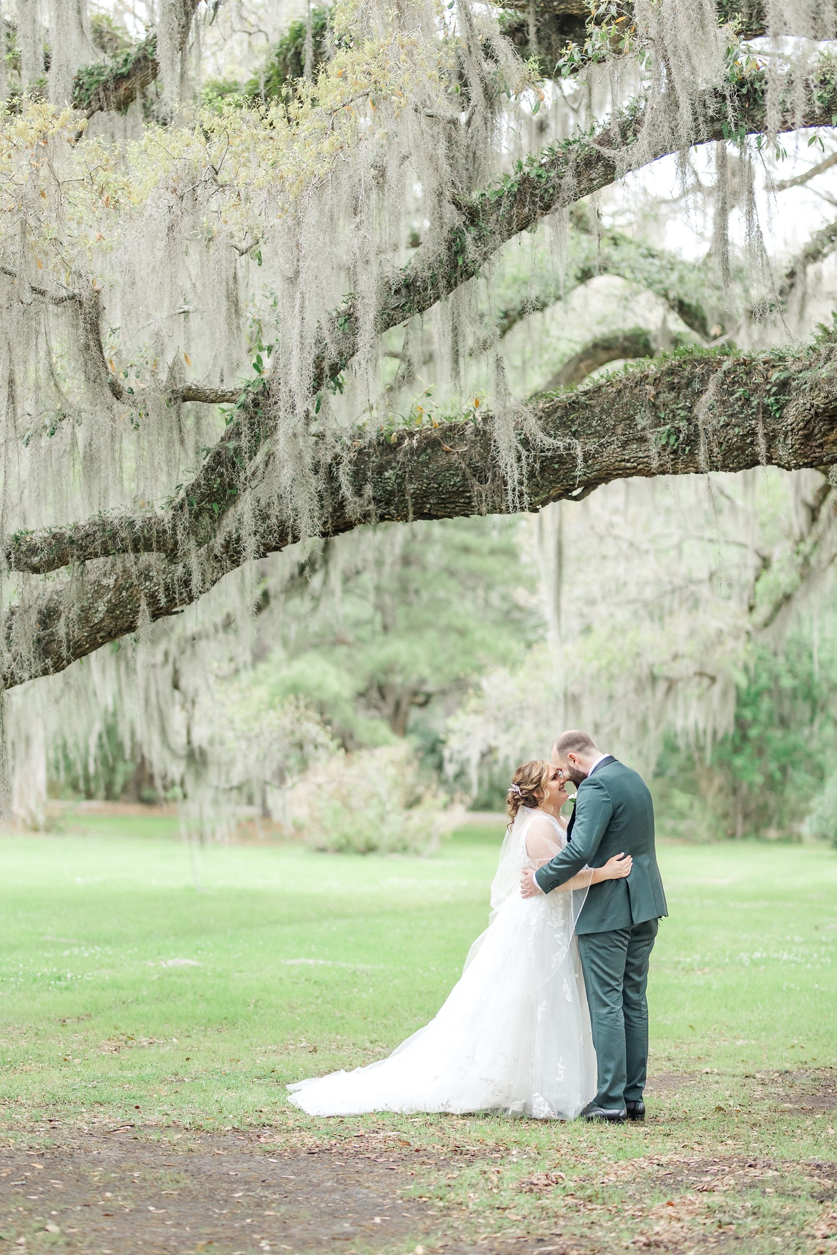 romantic moment of bride and groom at Magnolia plantation and gardens