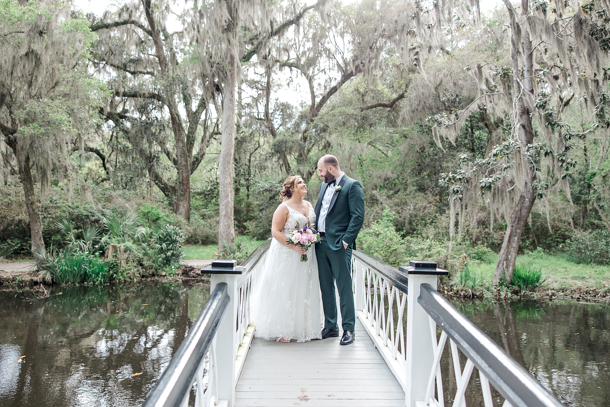 couple on the iconic white bridge at Magnolia