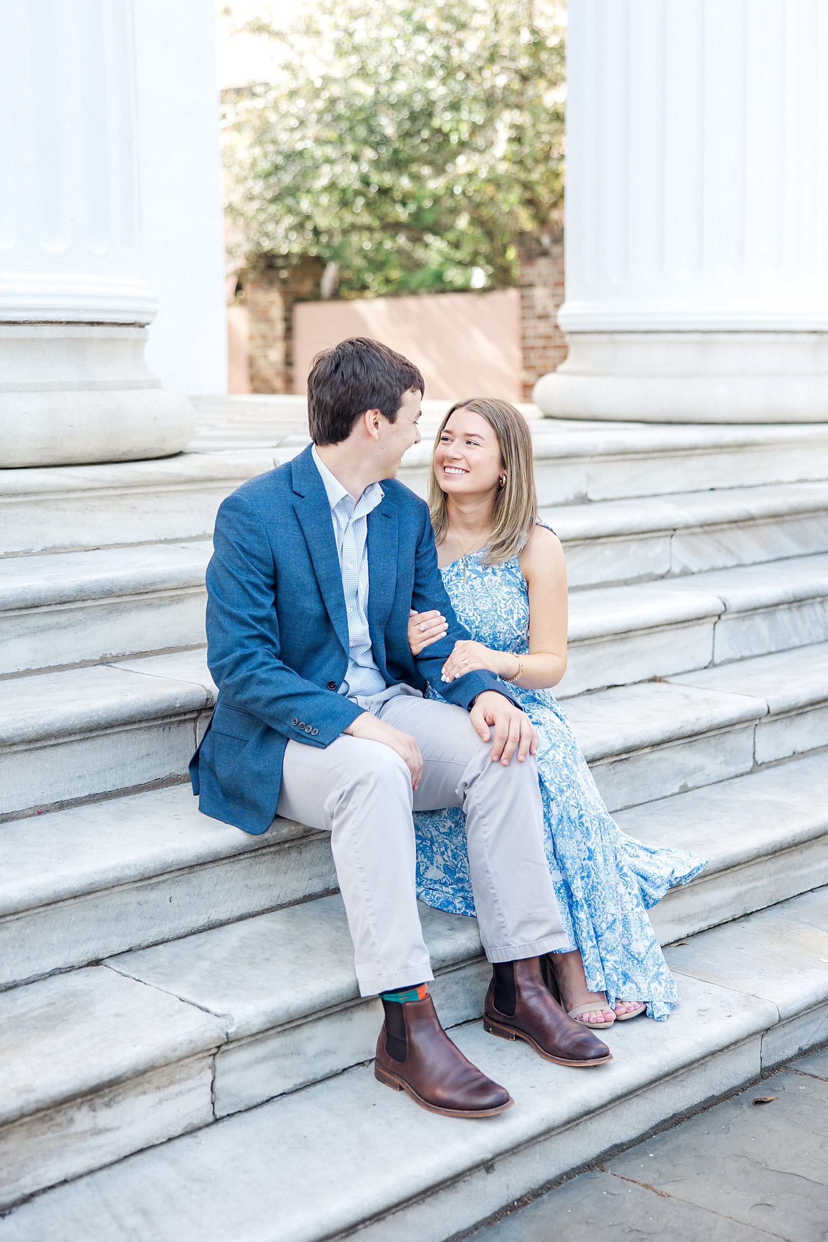 engagement portraits on stairs of historic Charleston building