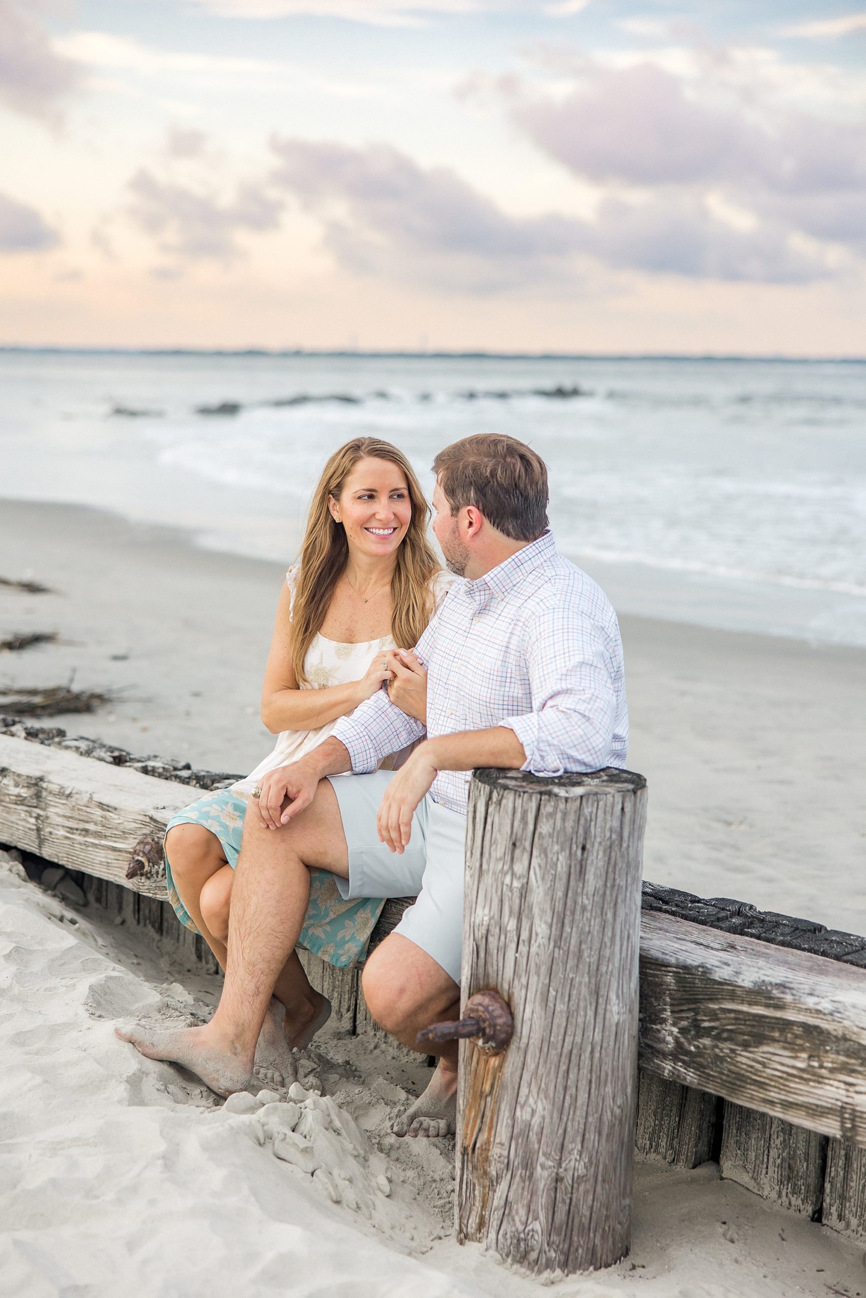 engaged couple sits together during SC engagement portraits