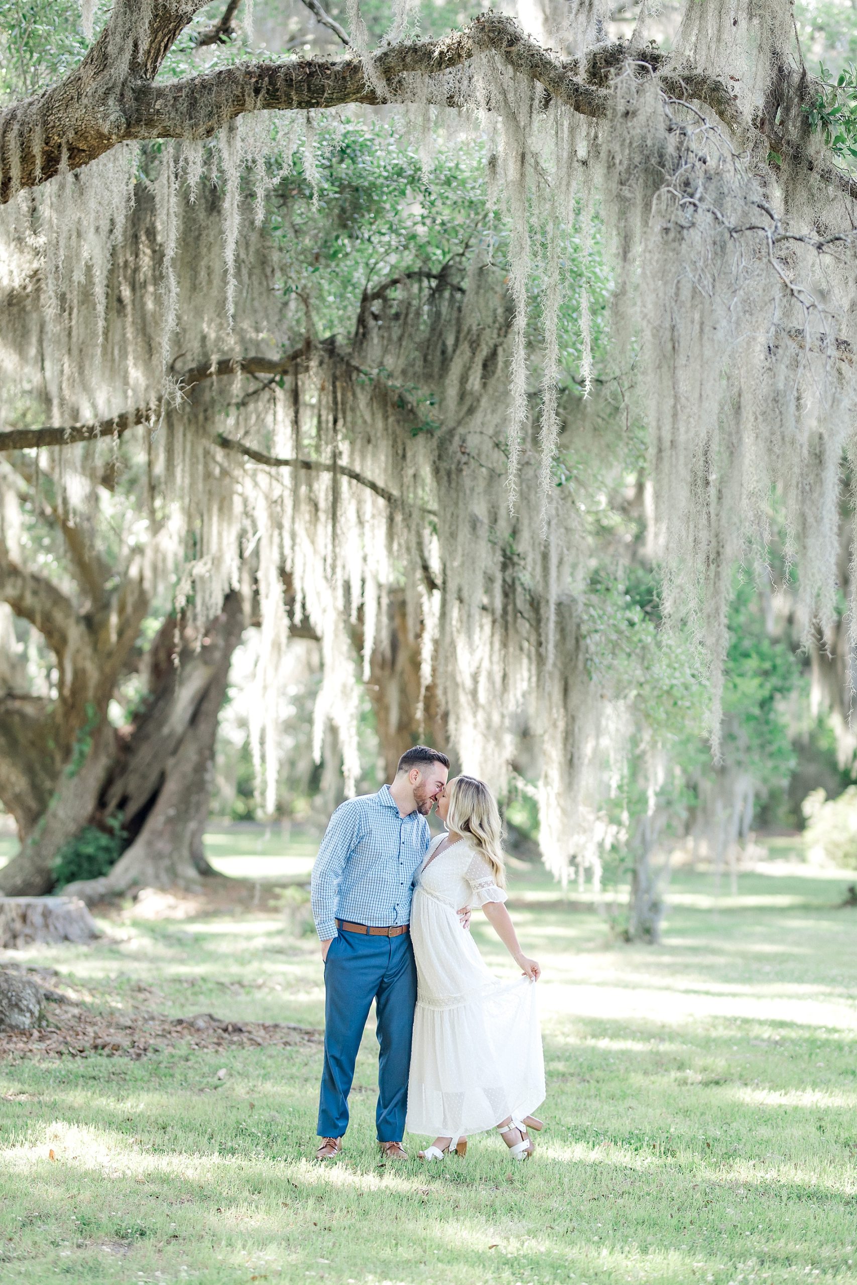 couple kiss during romantic engagement session