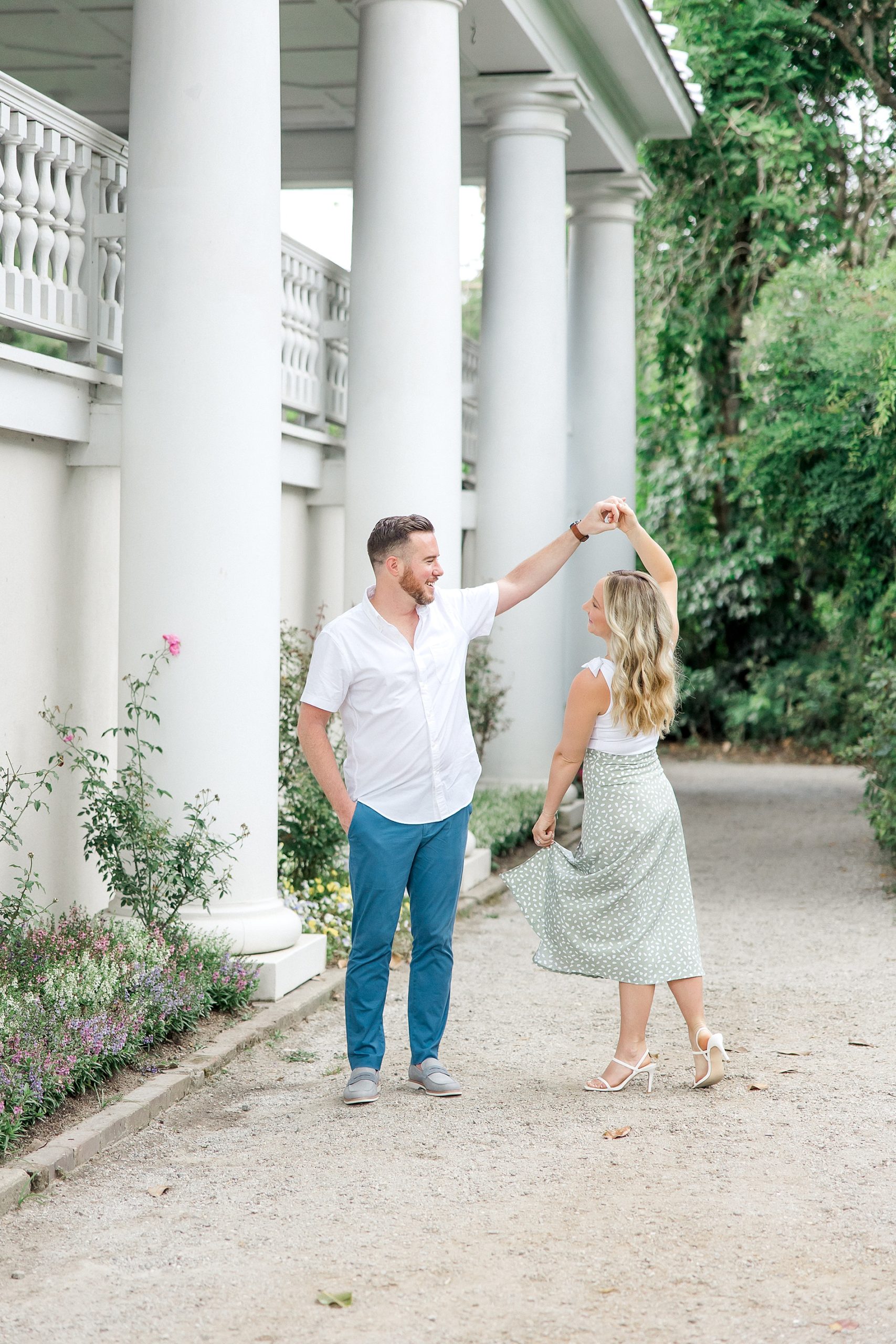 couple dance together during engagement session