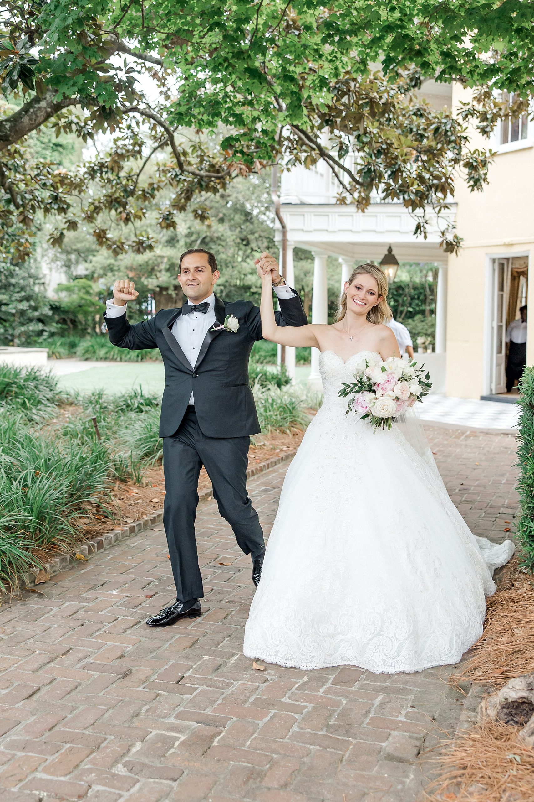 newlyweds make grand entrance to wedding reception at William Aiken House