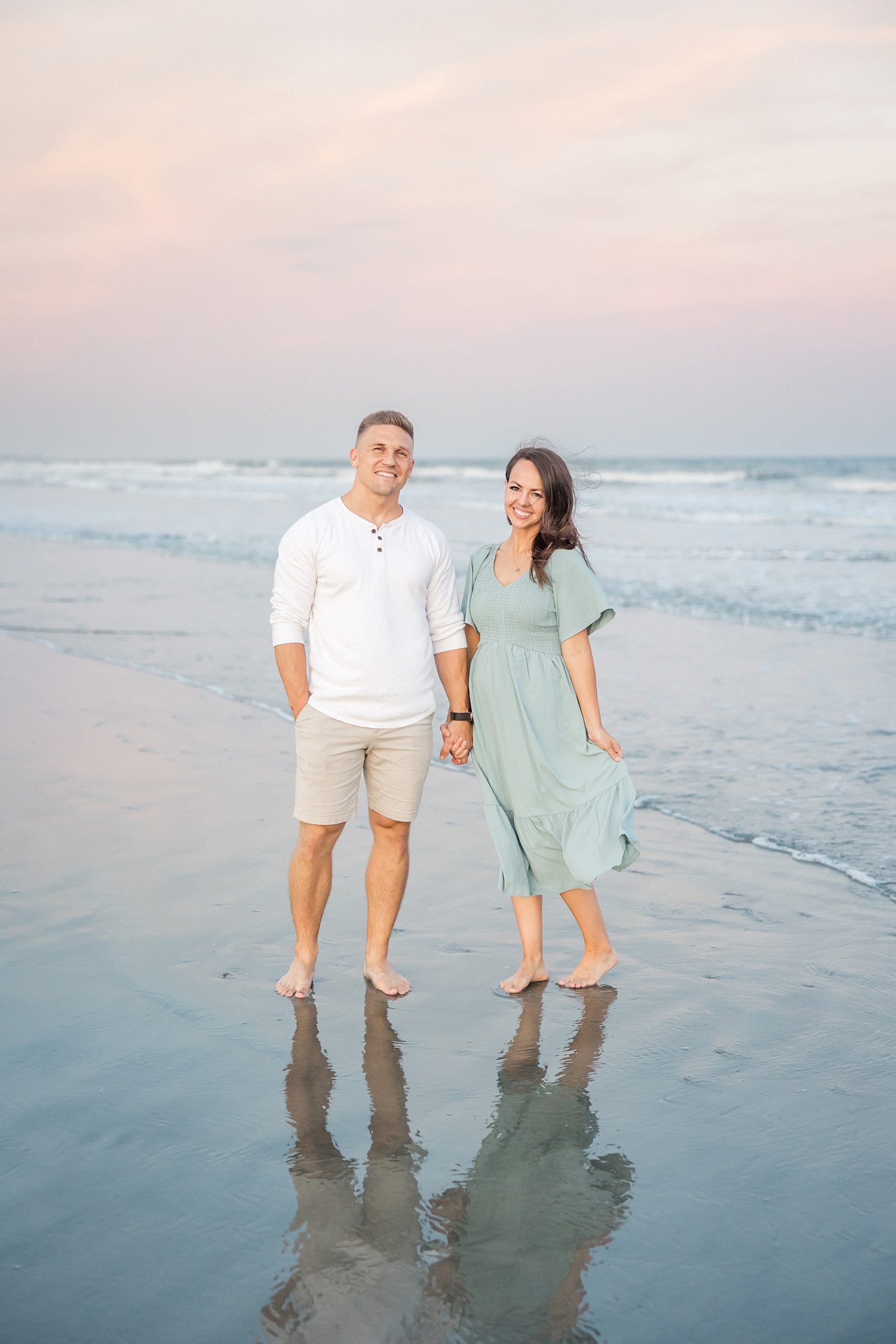 husband and wife during Beach Family portraits in South Carolina at Isle of Palms
