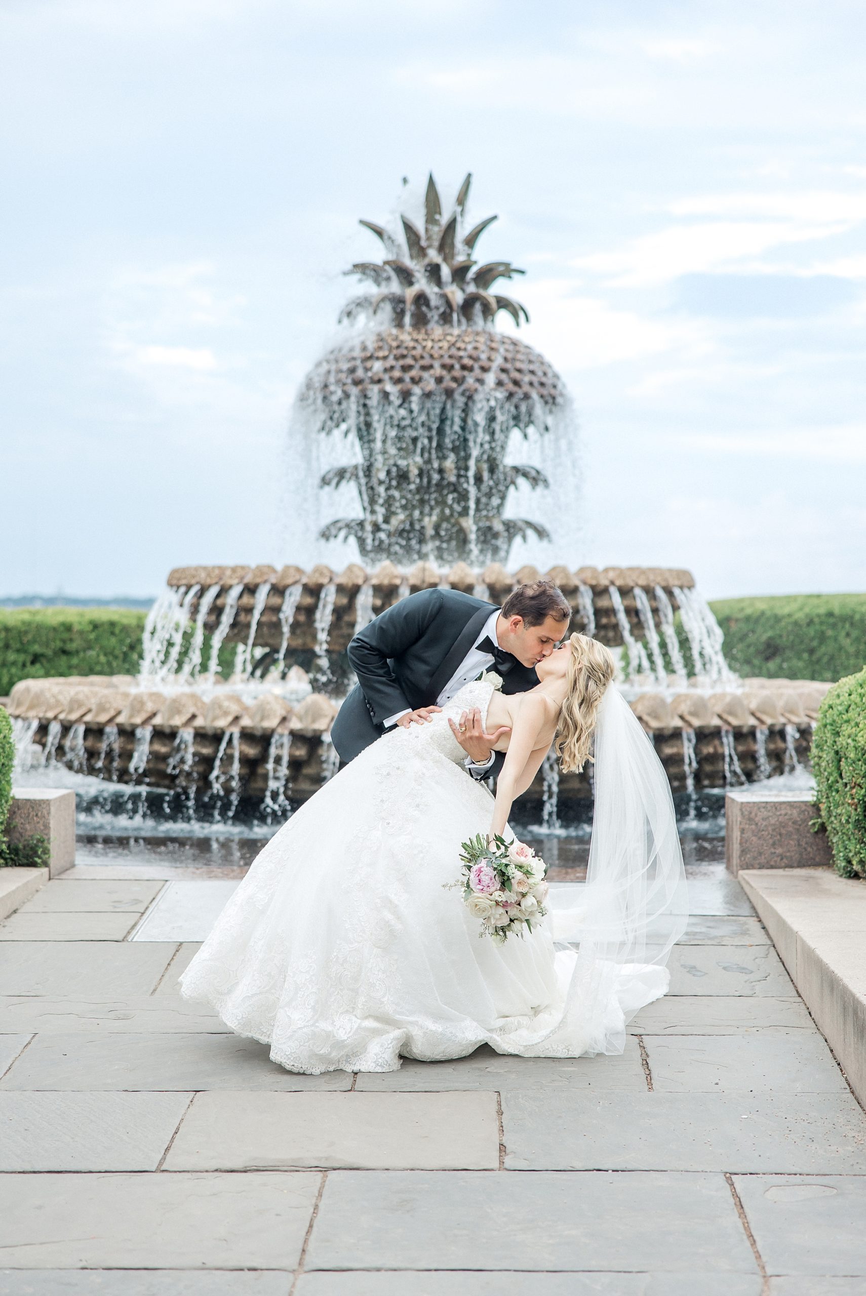 Charleston wedding portraits by iconic pineapple fountain