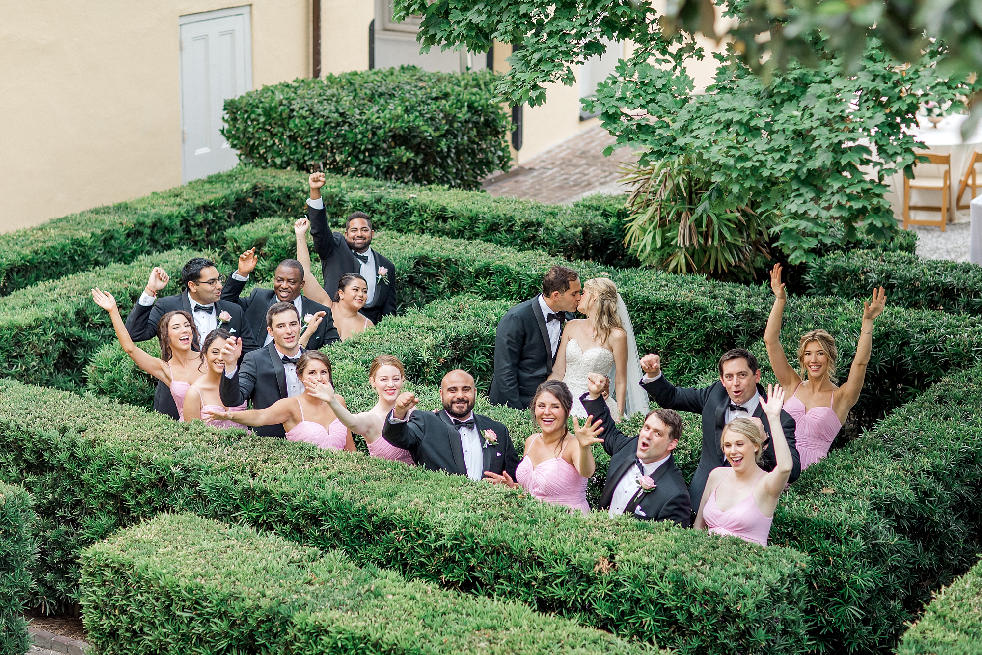 bridal party in garden maze during Romantic Charleston Wedding at William Aiken House