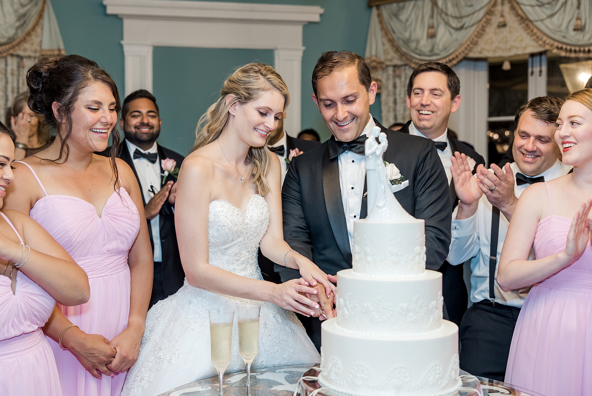 couple cut into wedding cake