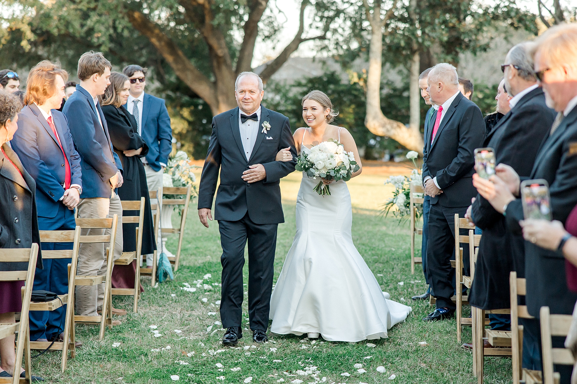 bride walks down the aisle at Lowndes Grove Winter Wedding