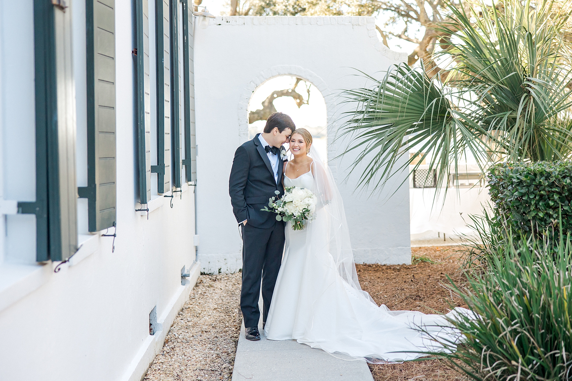 bride and groom outside of Lowndes Grove in Charleston