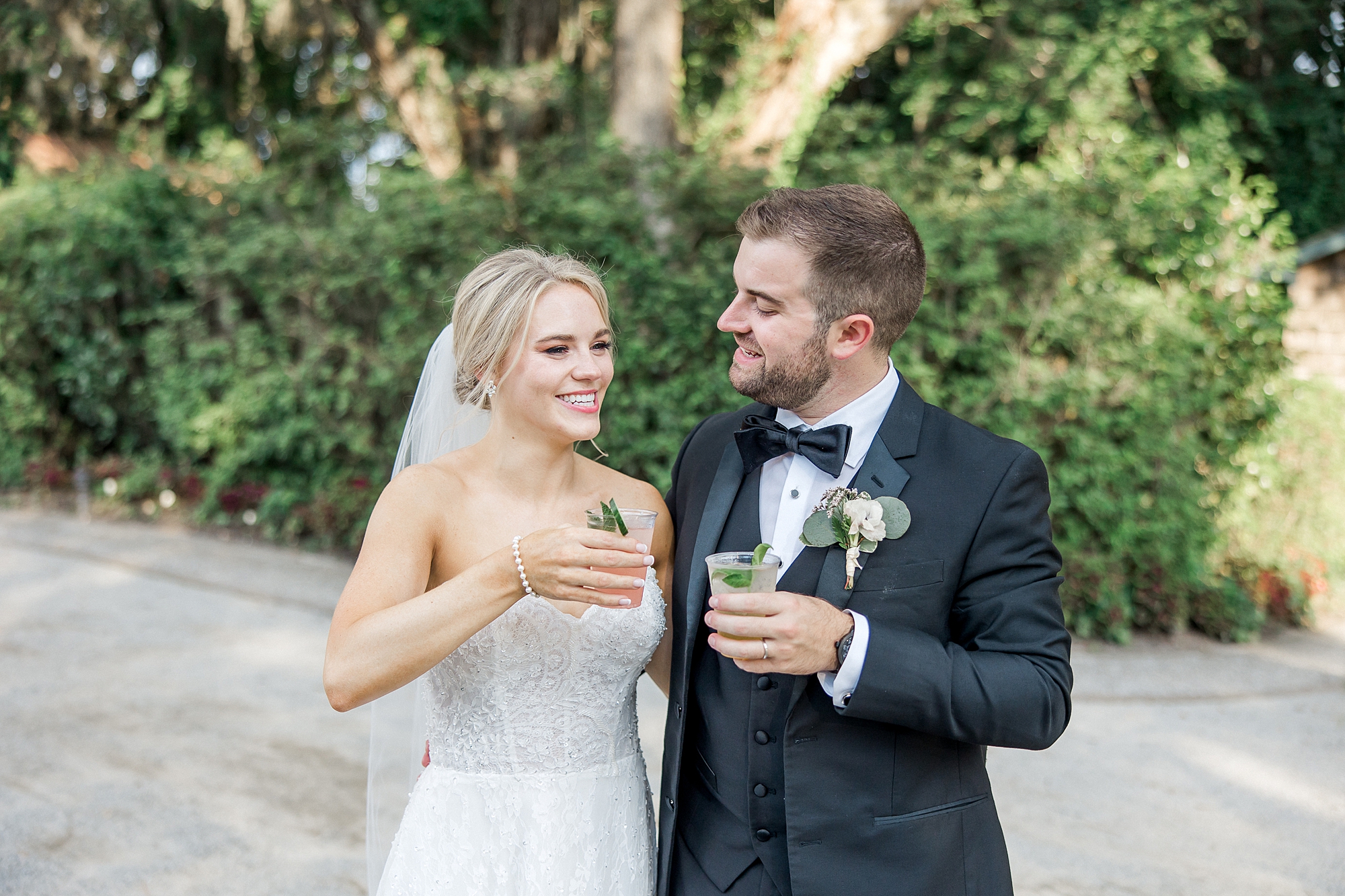 bride and groom cheers during cocktail hour