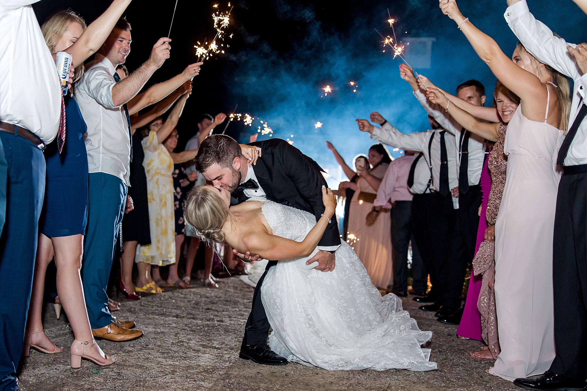 epic kiss during sparkler wedding exit