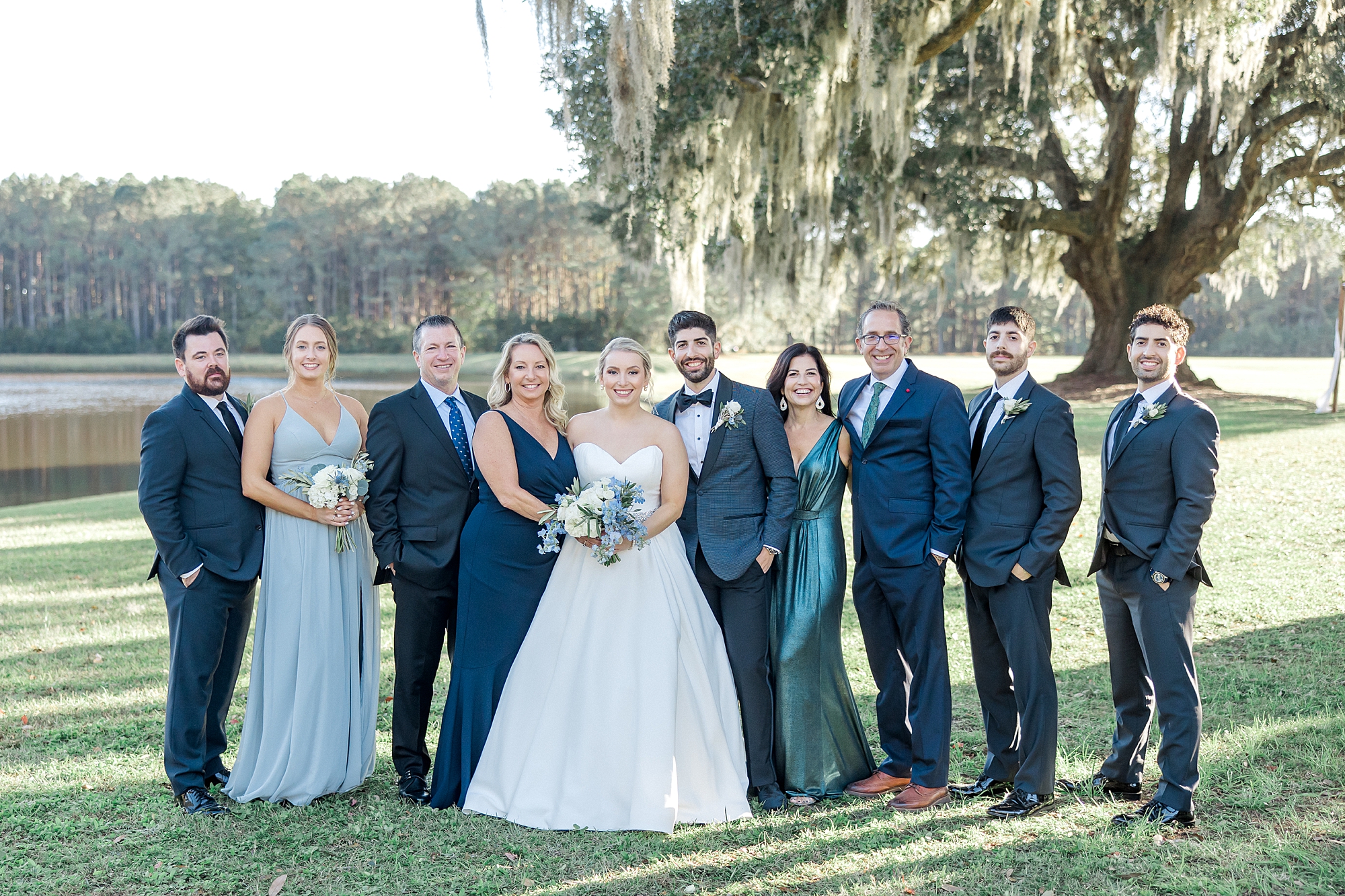 bride and groom with family on Charleston wedding day