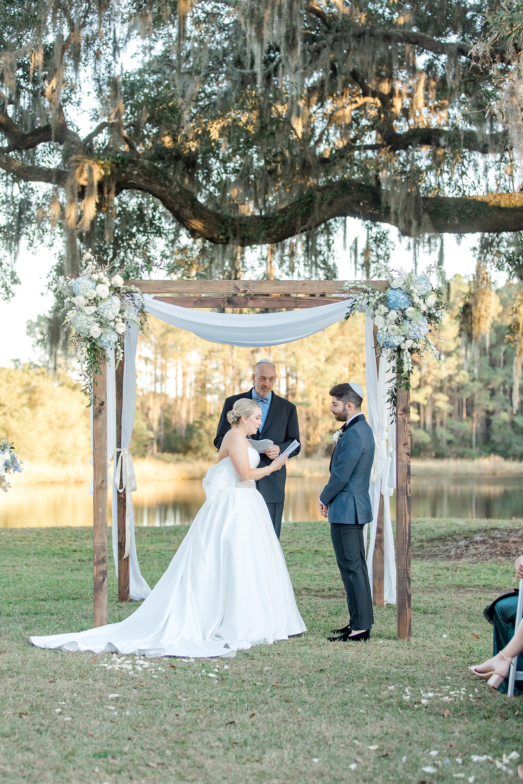 couple exchanging vows at outdoor fall wedding ceremony