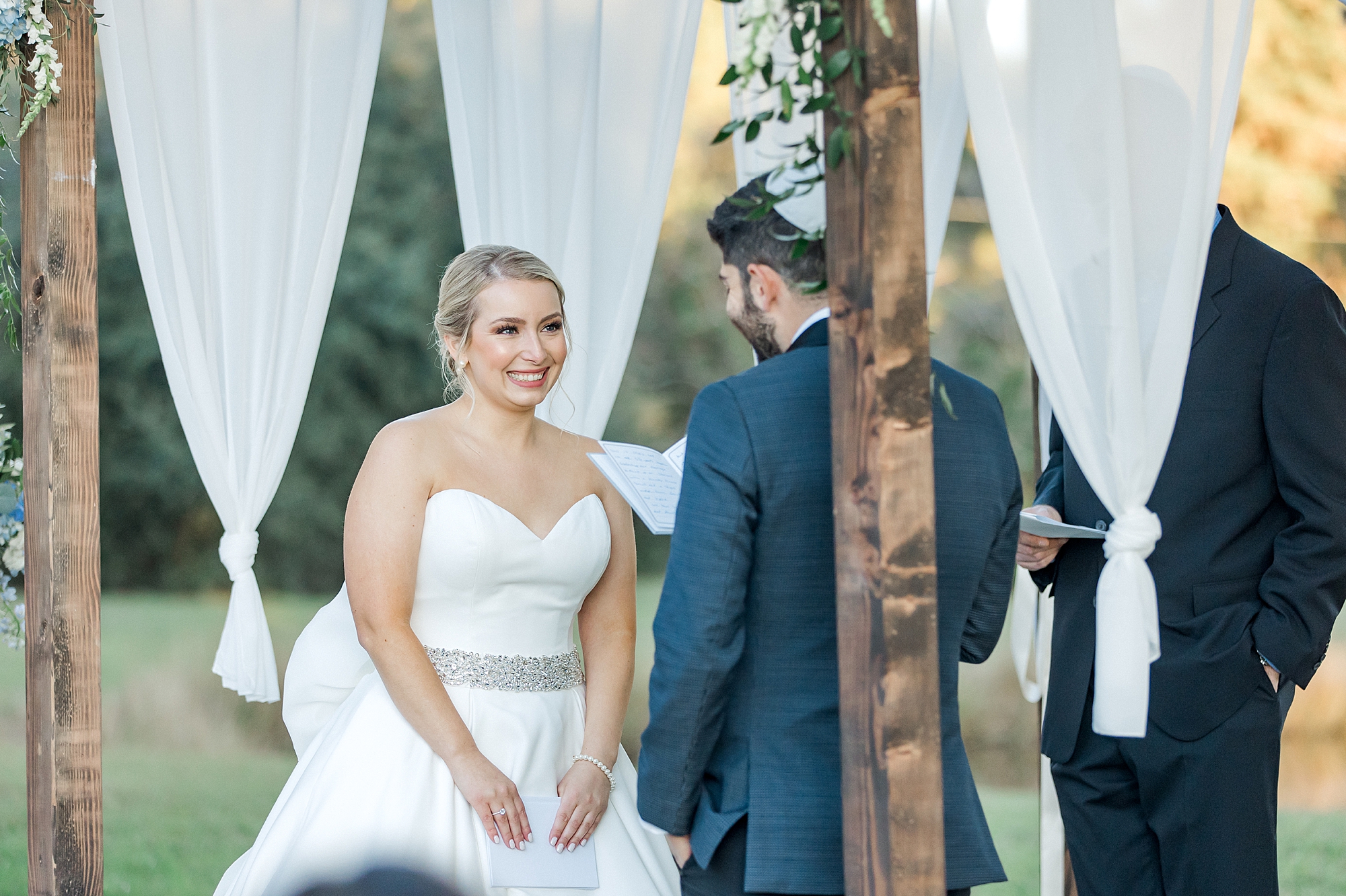 groom reads vows to bride