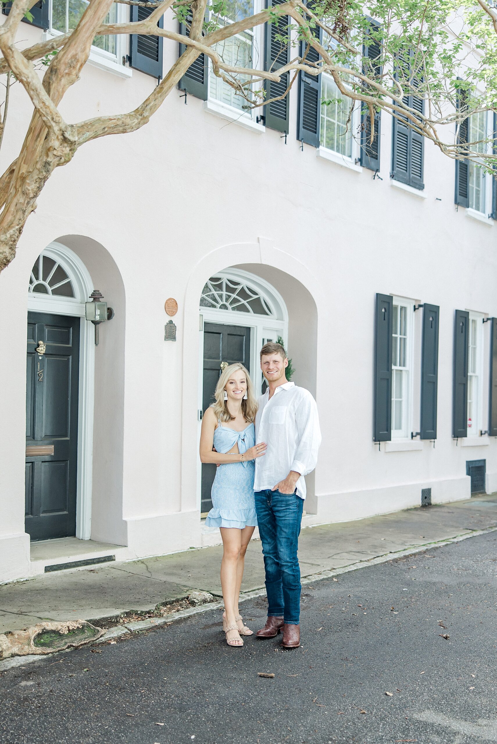 Couple in front of historic Charleston building
