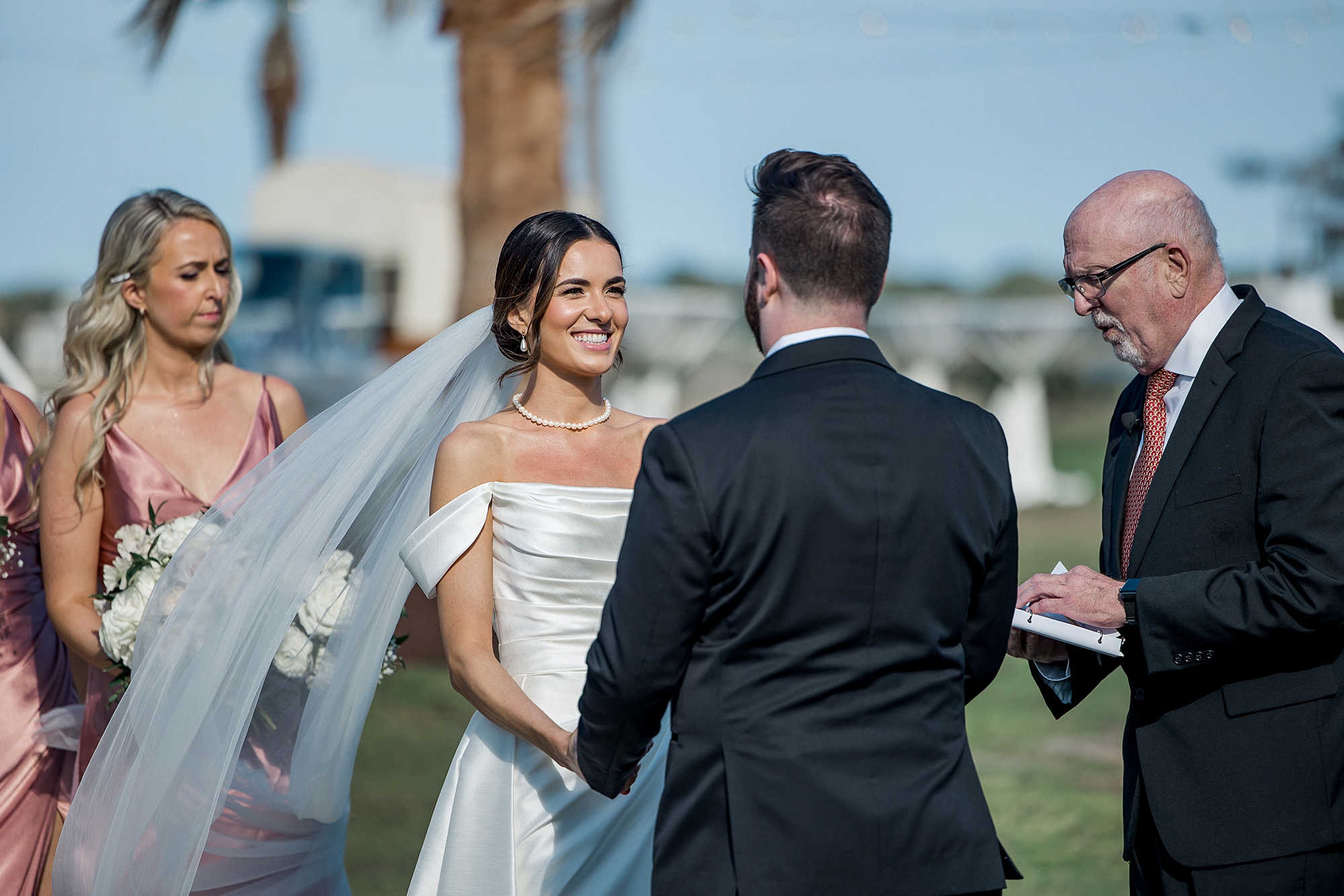 bride and groom exchange vows during Waterfront Charleston Harbor Wedding