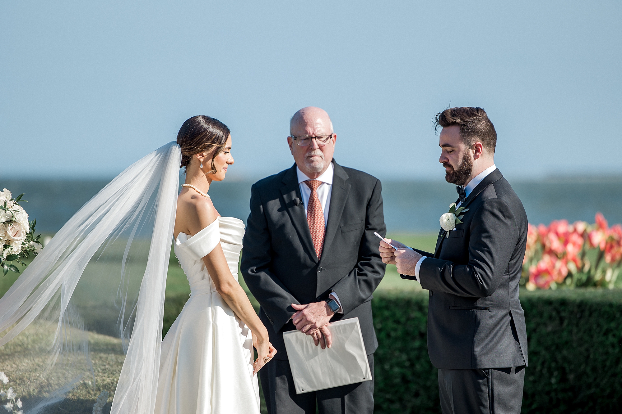 groom reads vows during coastal charleston wedding