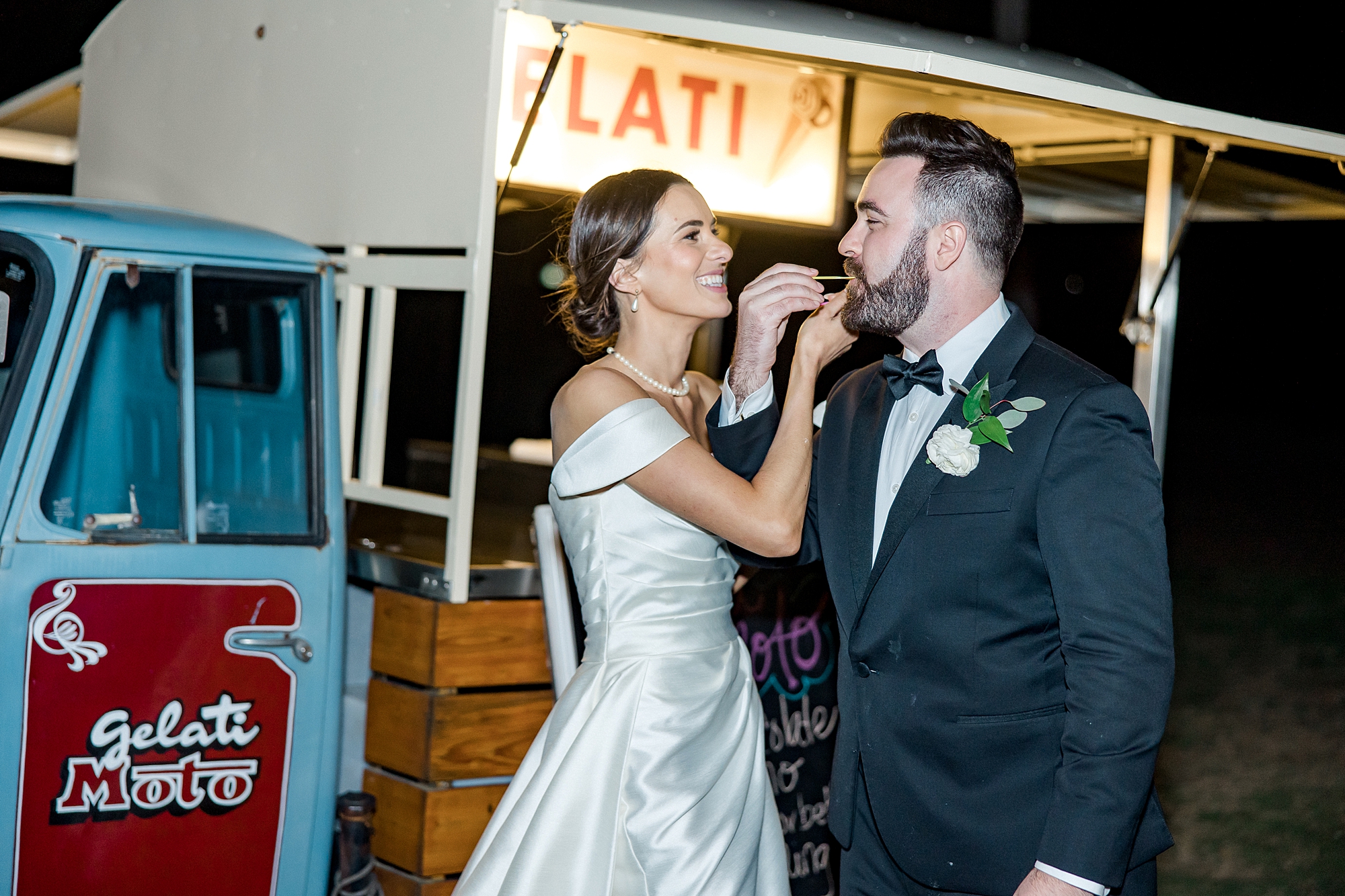 couple enjoy gelato after their Waterfront Charleston Wedding at Patriots Point Links