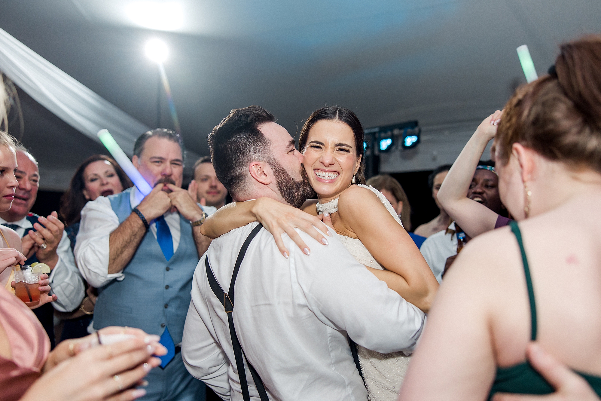 groom kisses bride on the dance floor