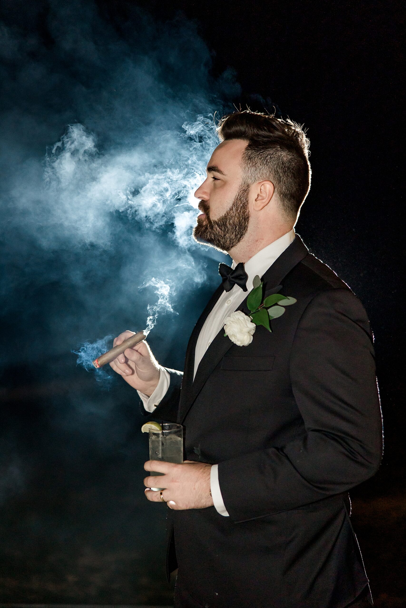 groom smokes cigar